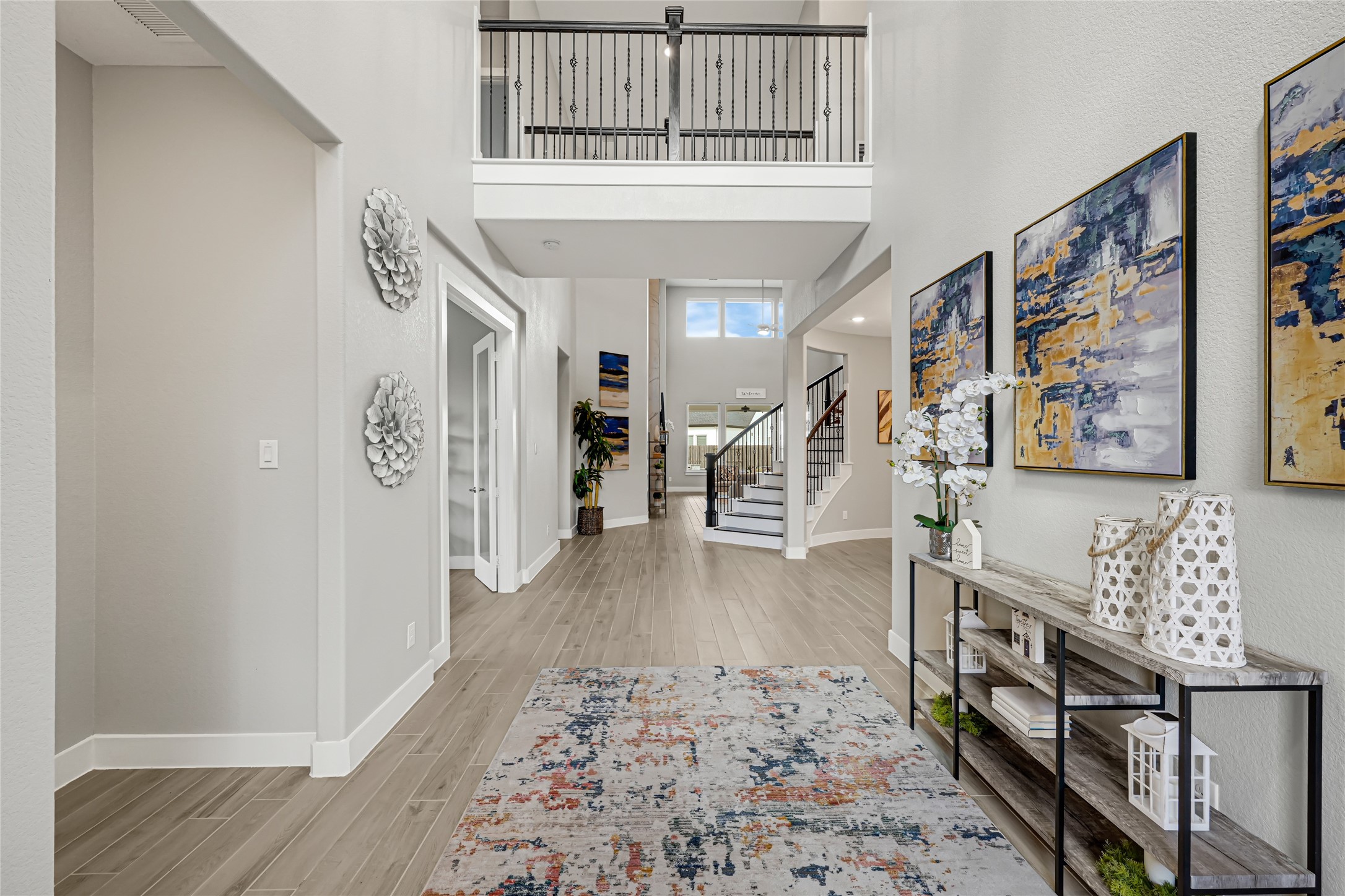 Bright family living area with high ceilings and large windows.