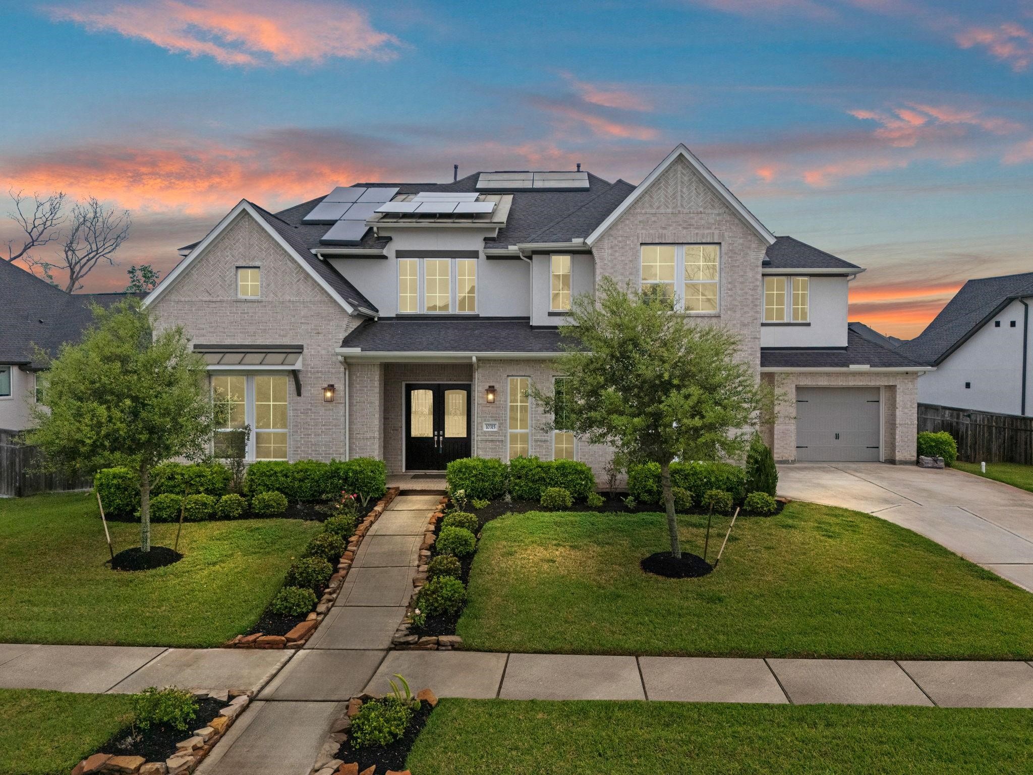 Stunning stucco and Brick elevation with Grand double door entry , and 3 car garage
