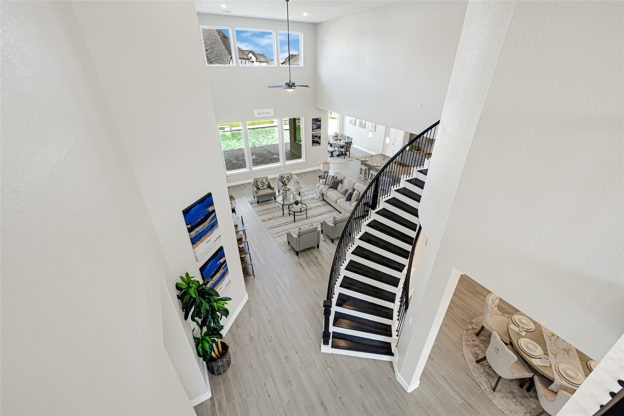 Dramatic staircase and foyer view highlighting the home's open design.