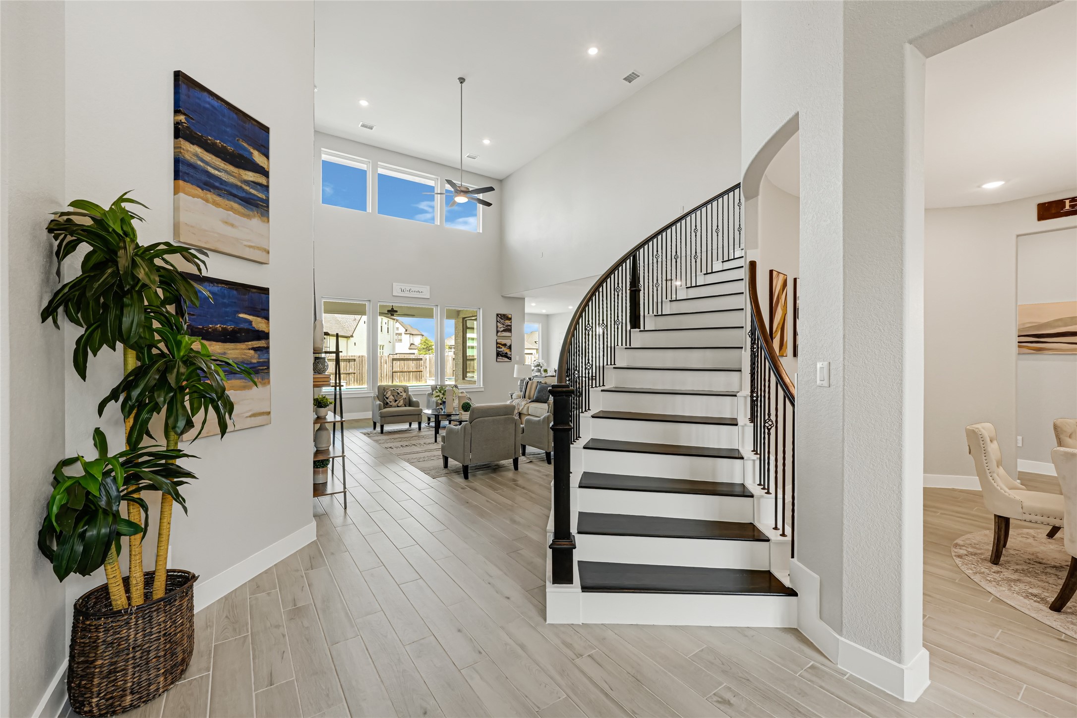 Grand foyer featuring soaring ceilings and a dramatic staircase.