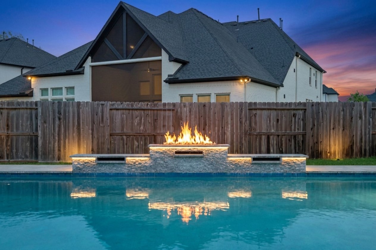 Sparkling backyard pool with private fenced surroundings.