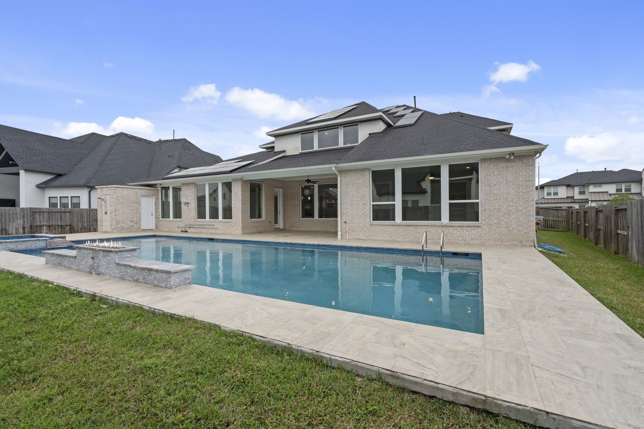 Stunning pool and backyard creating a private outdoor retreat.