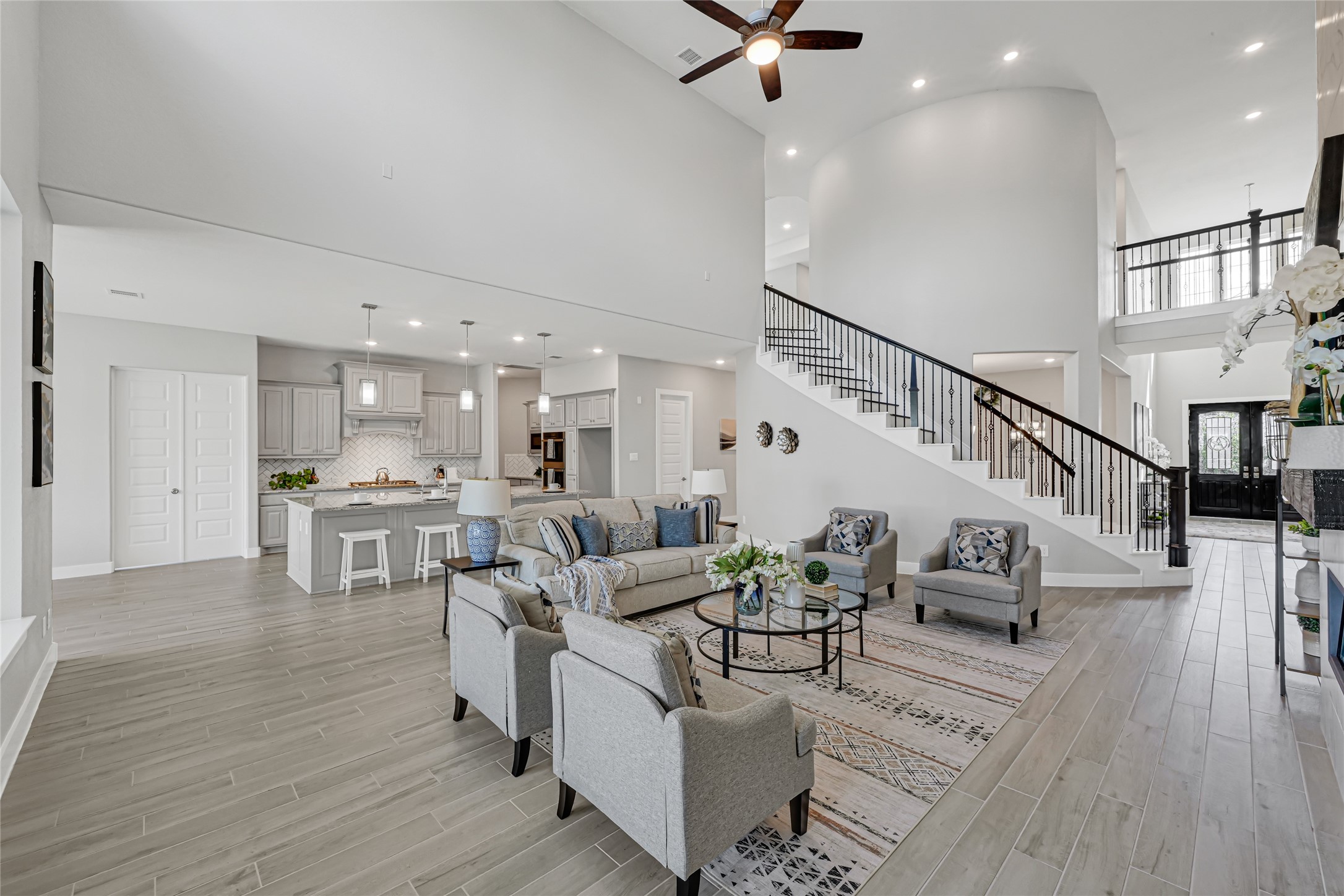 Open-concept living space connecting the kitchen, dining and family areas.