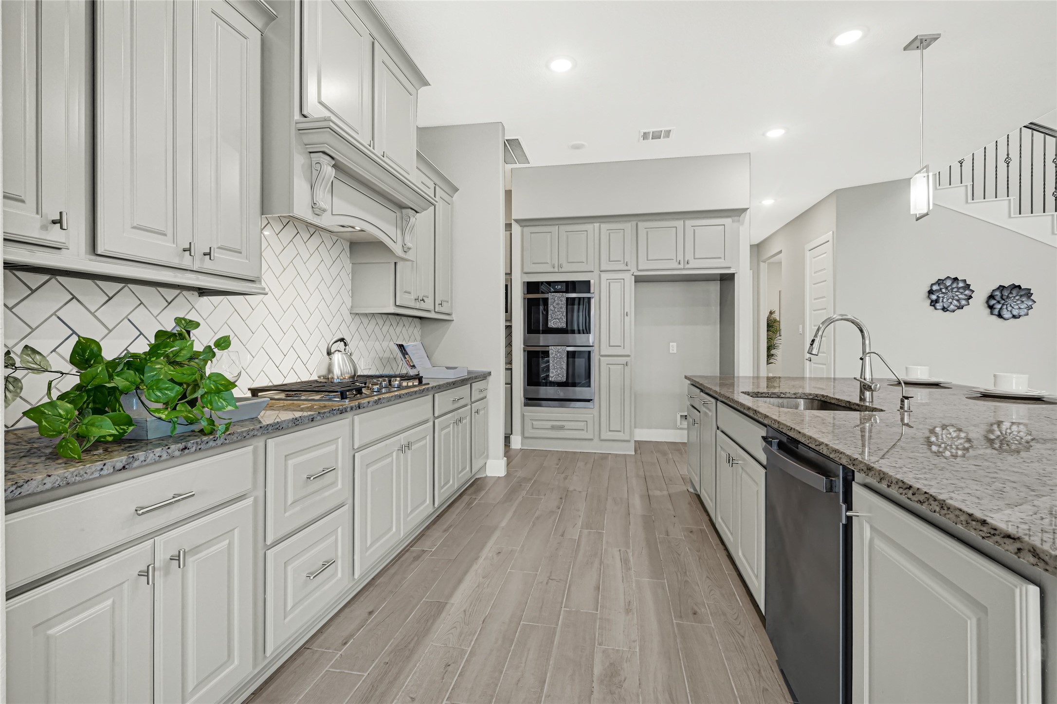 Well-appointed kitchen featuring extensive cabinetry, Upgraded Double oven and modern appliances.