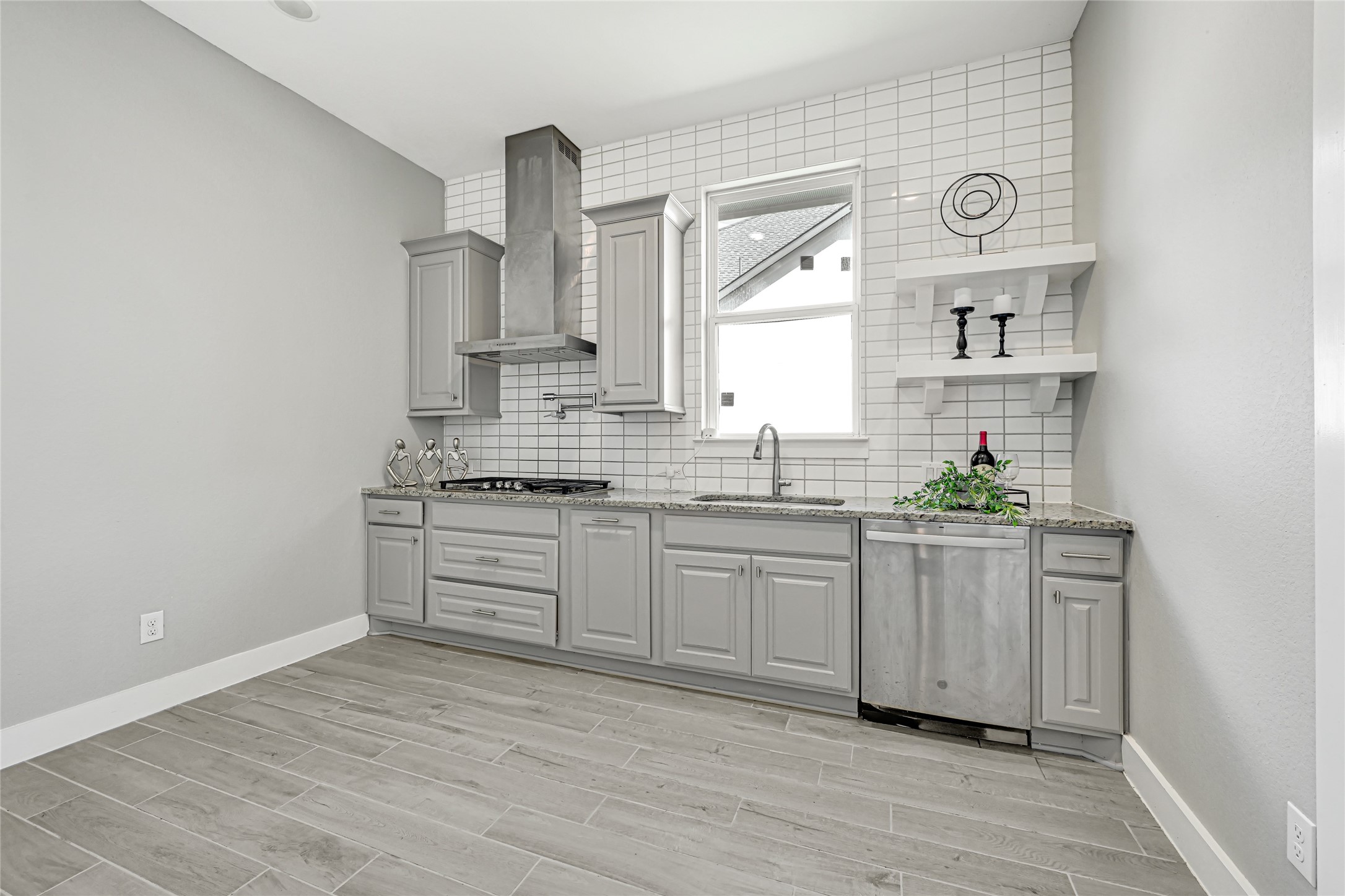 Secondary kitchen/spice kitchen with cabinetry and functional workspace. The kitchen has a full blown pantry