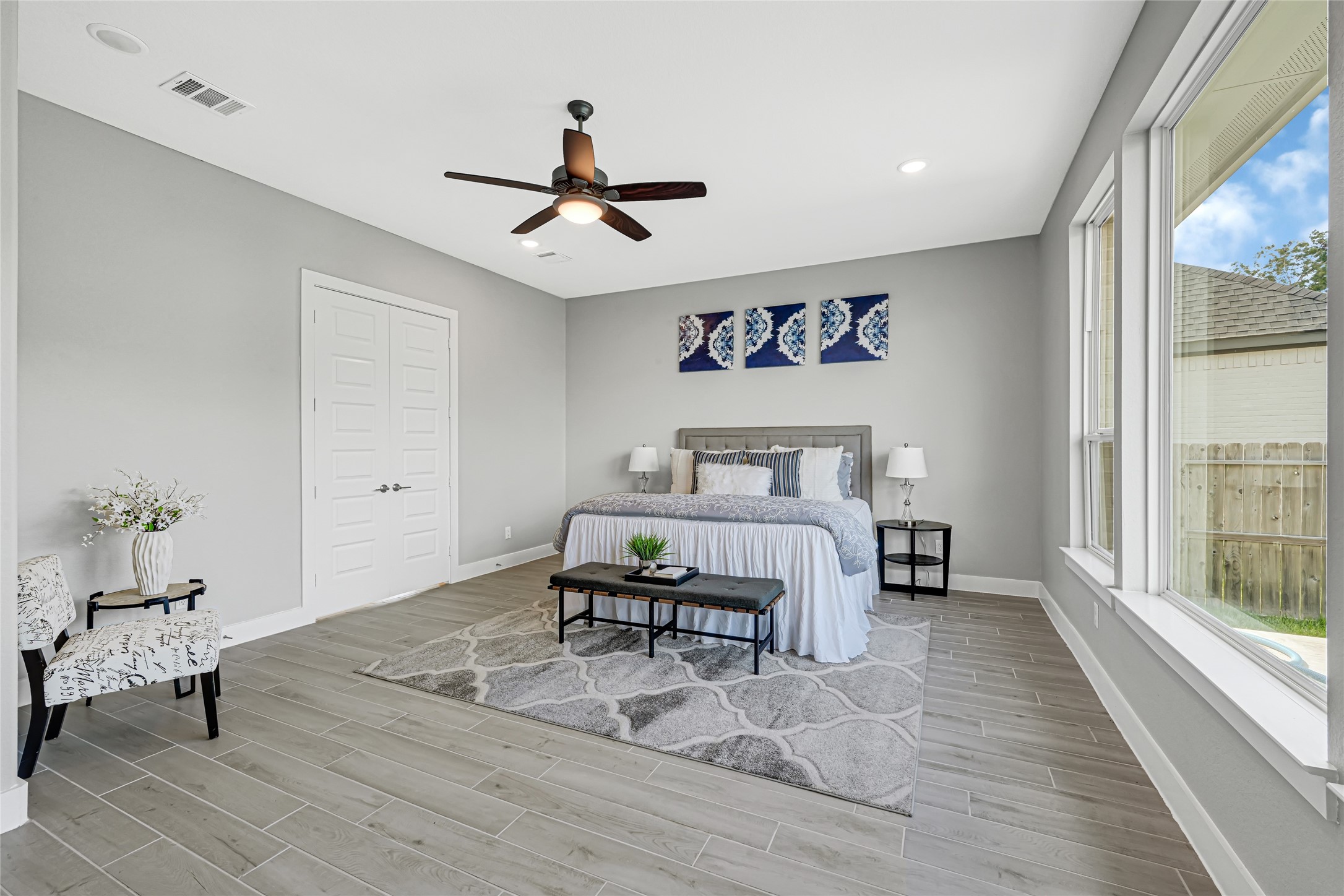 Luxurious primary suite with spacious layout and natural light.