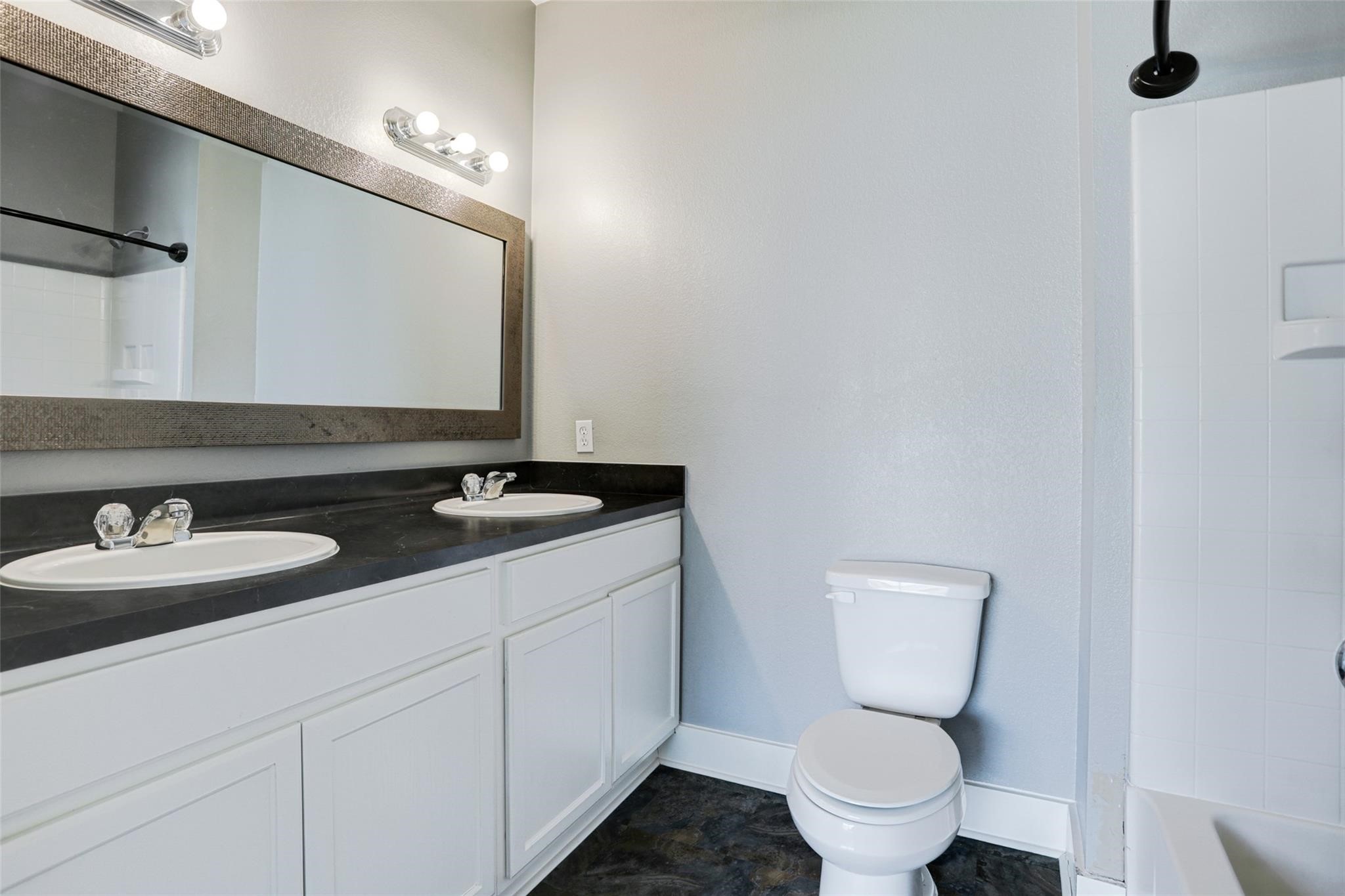 Primary private bathroom with double sinks