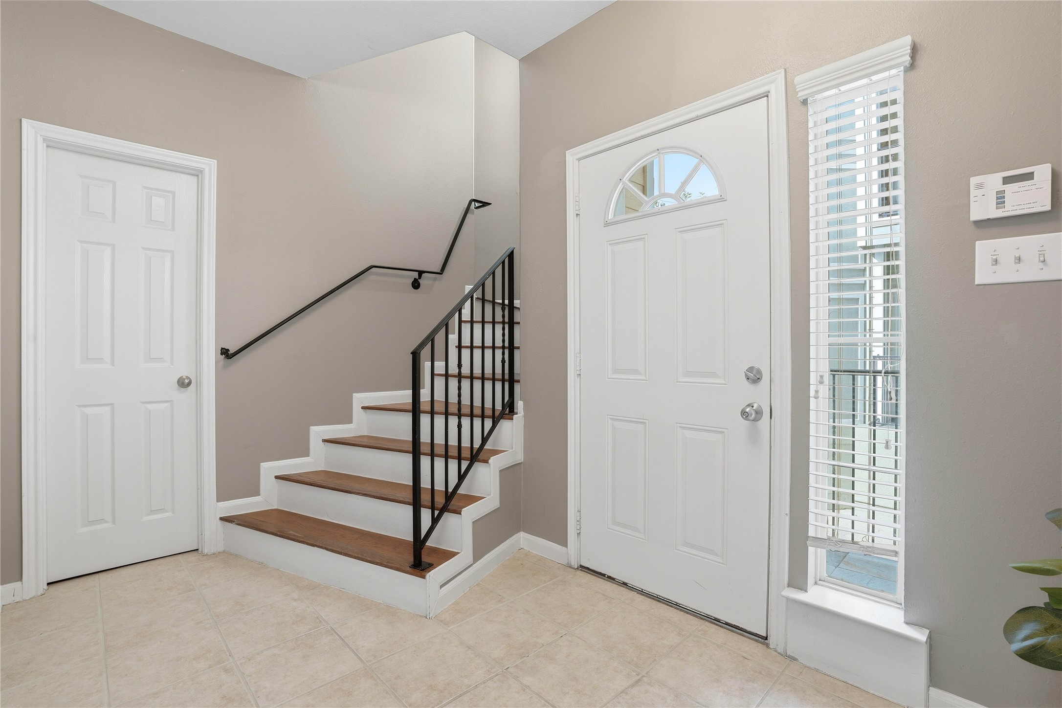 Private entry way with storage room and bedroom on first leve
