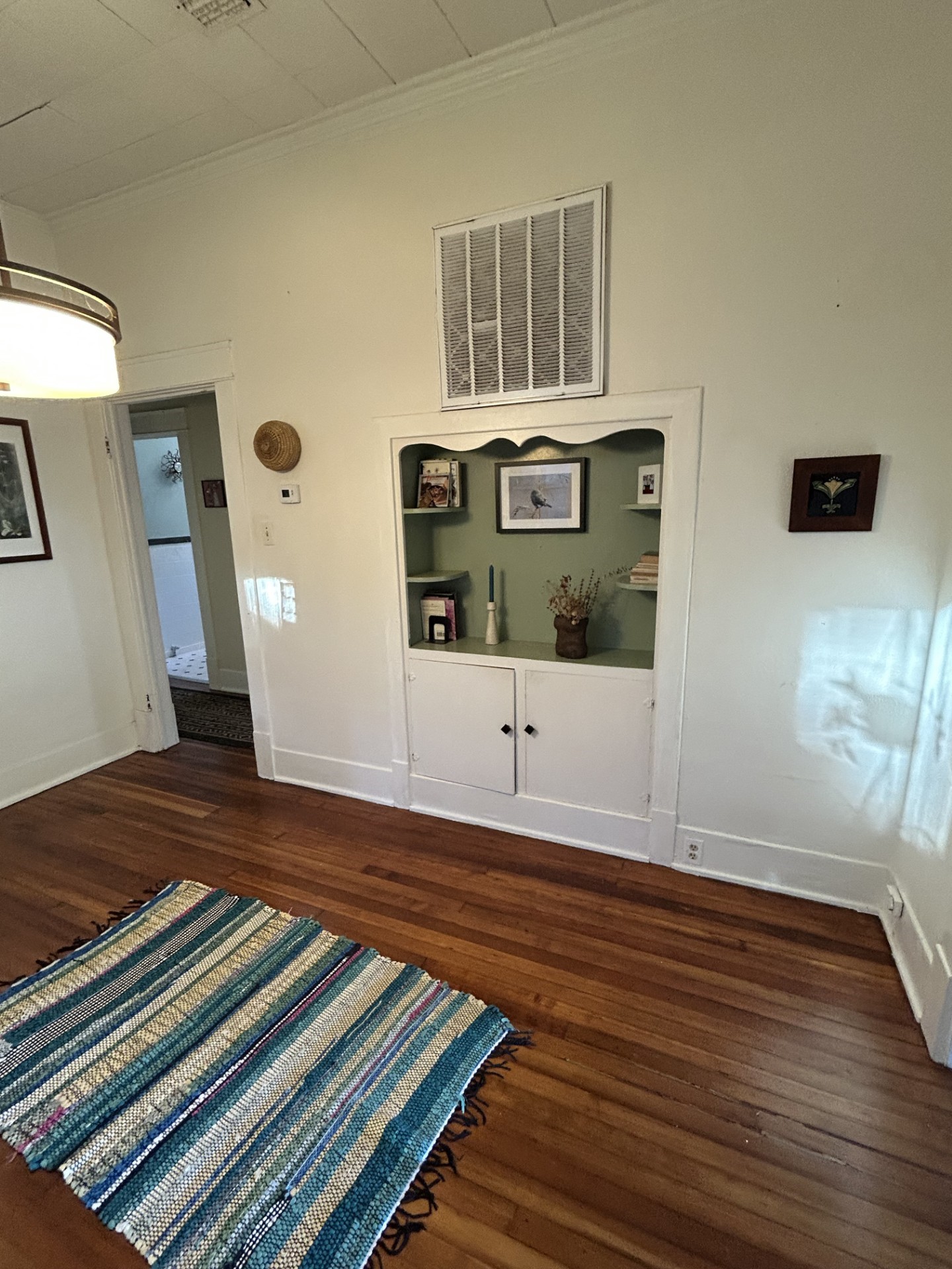 Formal dining room with west hutch. Doorway to the left goes to the two bedrooms and full bath.