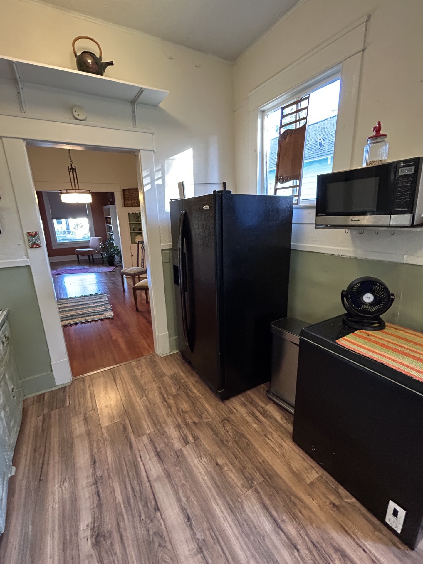 Kitchen with freezer on the right and refrigerator next to the left.