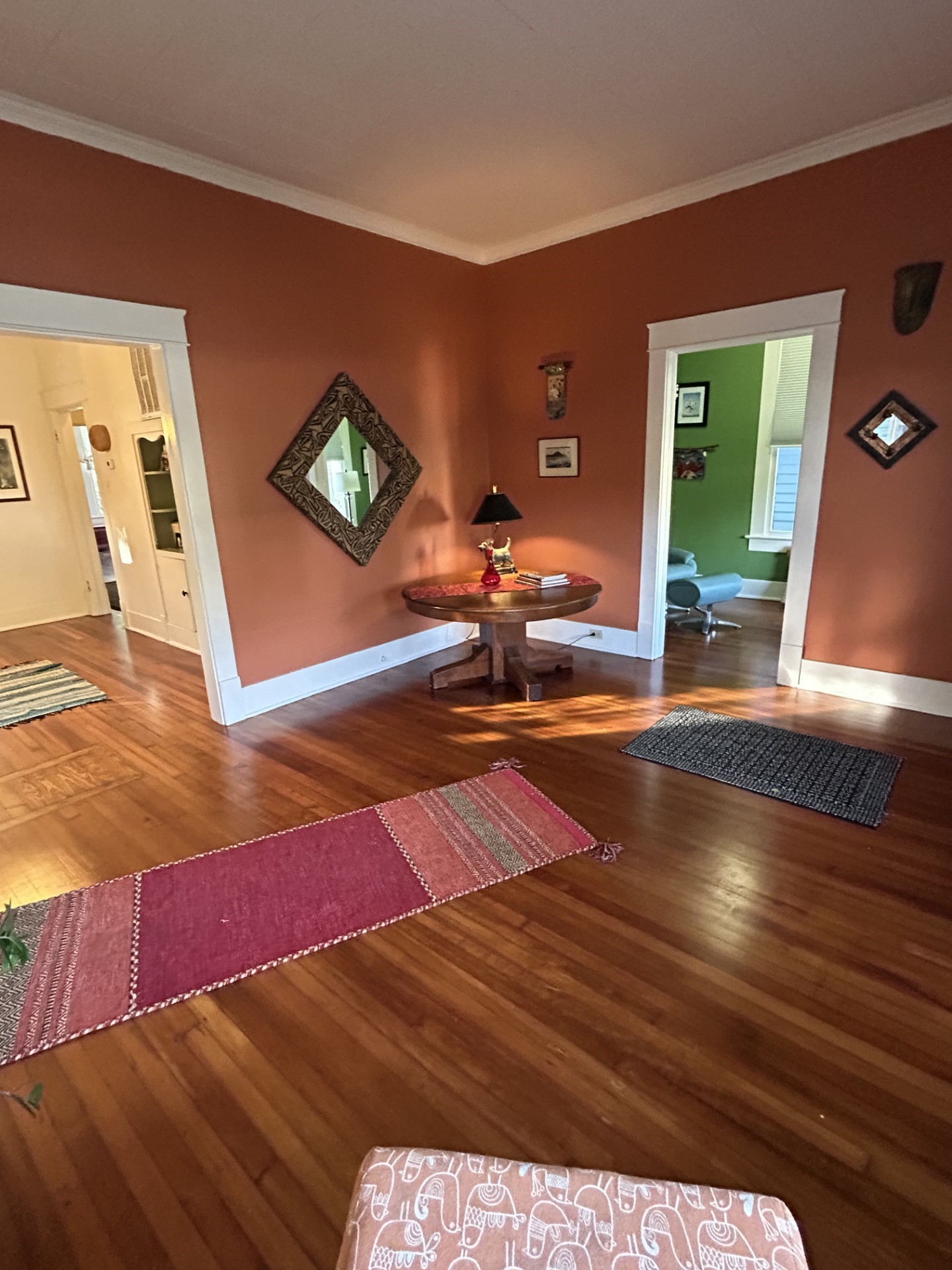 Living view with home office/study to the right and formal dining room to the left.