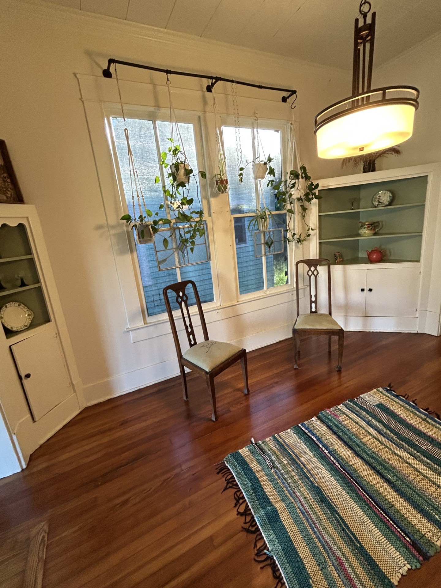 Quartersawn longleaf antique pine floors in many room. The dining room has three hutches. The northeast hutch and the southeast hutch are pictured here. In the windows are the hurricane fabric for window protection.