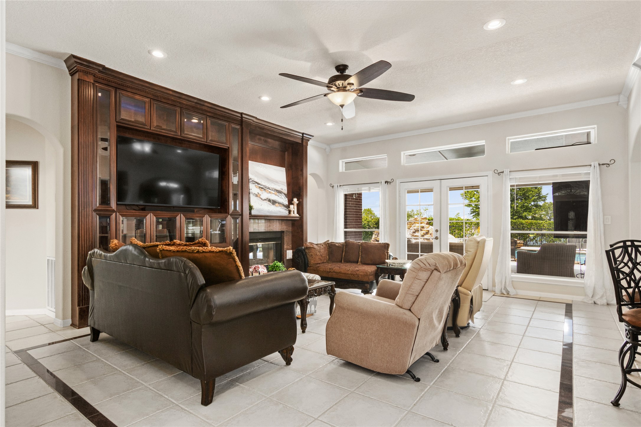 Living room looks over beautiful resort style pool