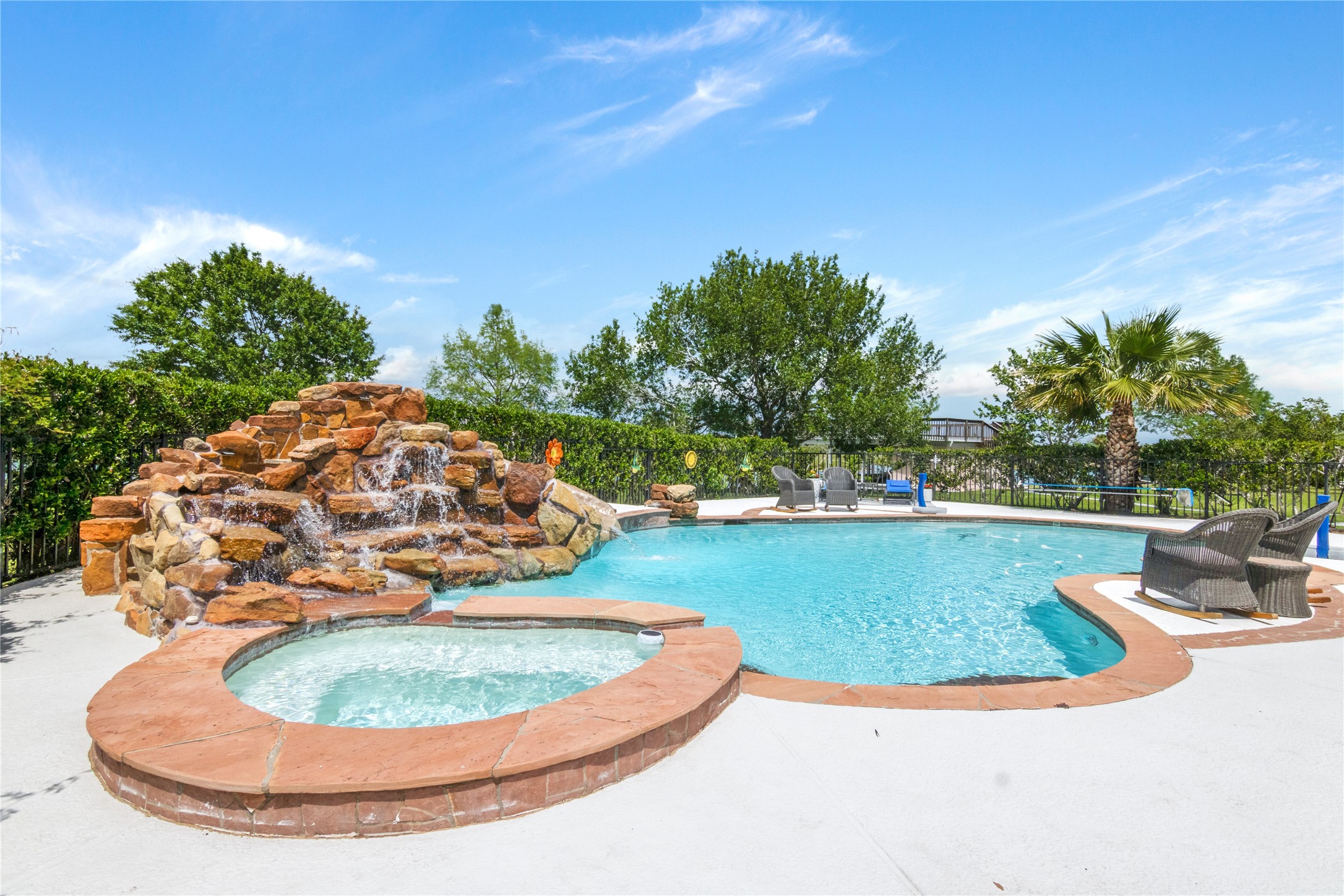Resort Style pool with hot tub and waterfall