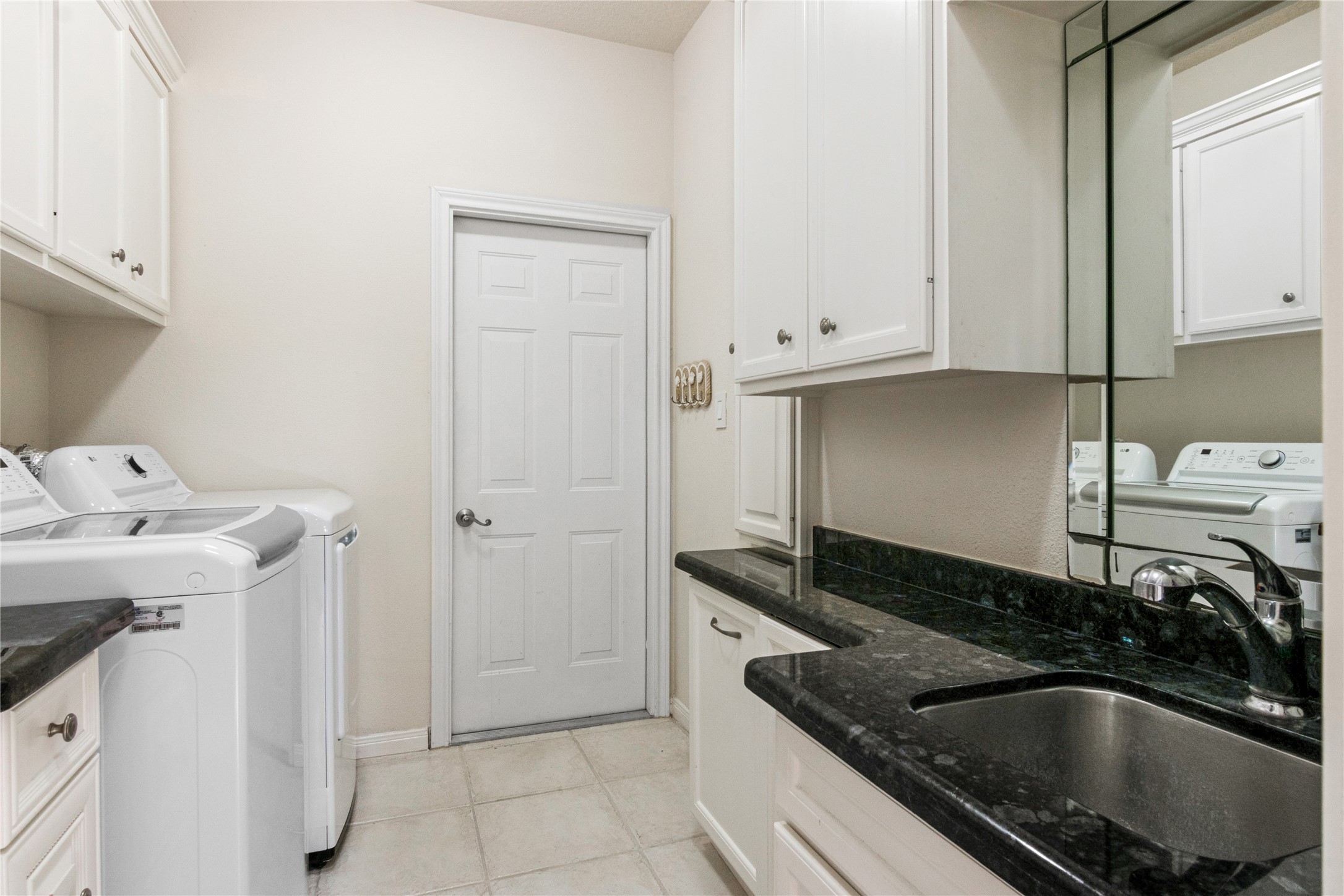 Expansive Laundry Room with utility sink