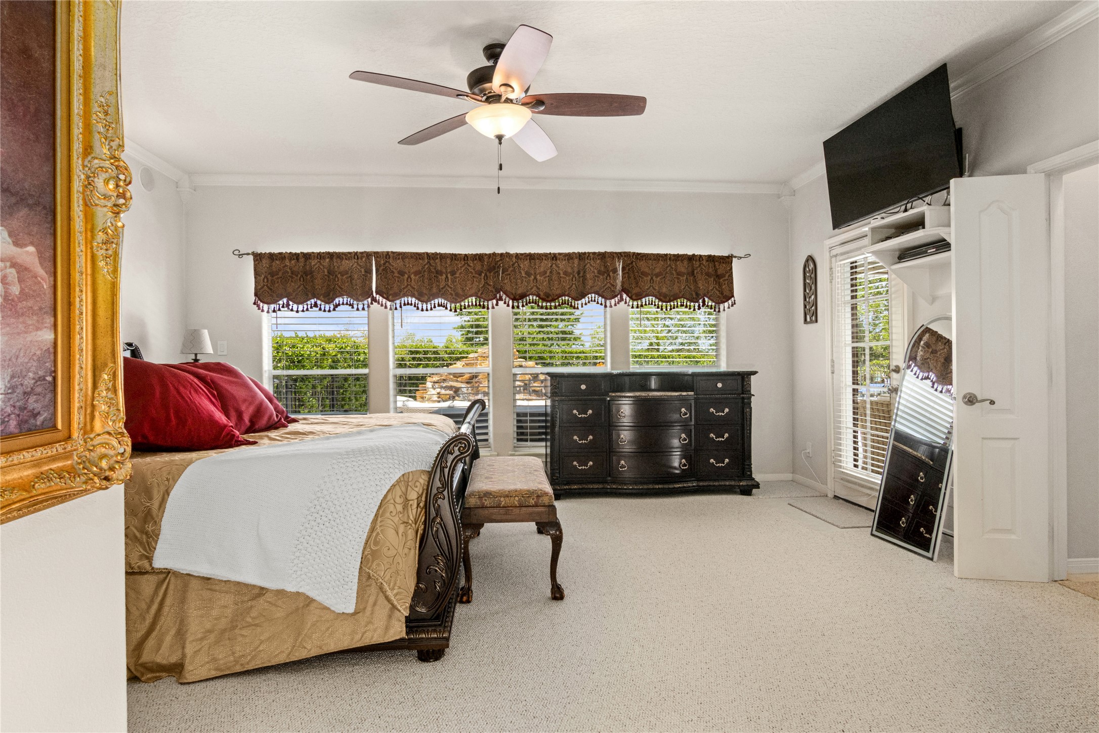 Primary Bedroom large windows overlooking pool
