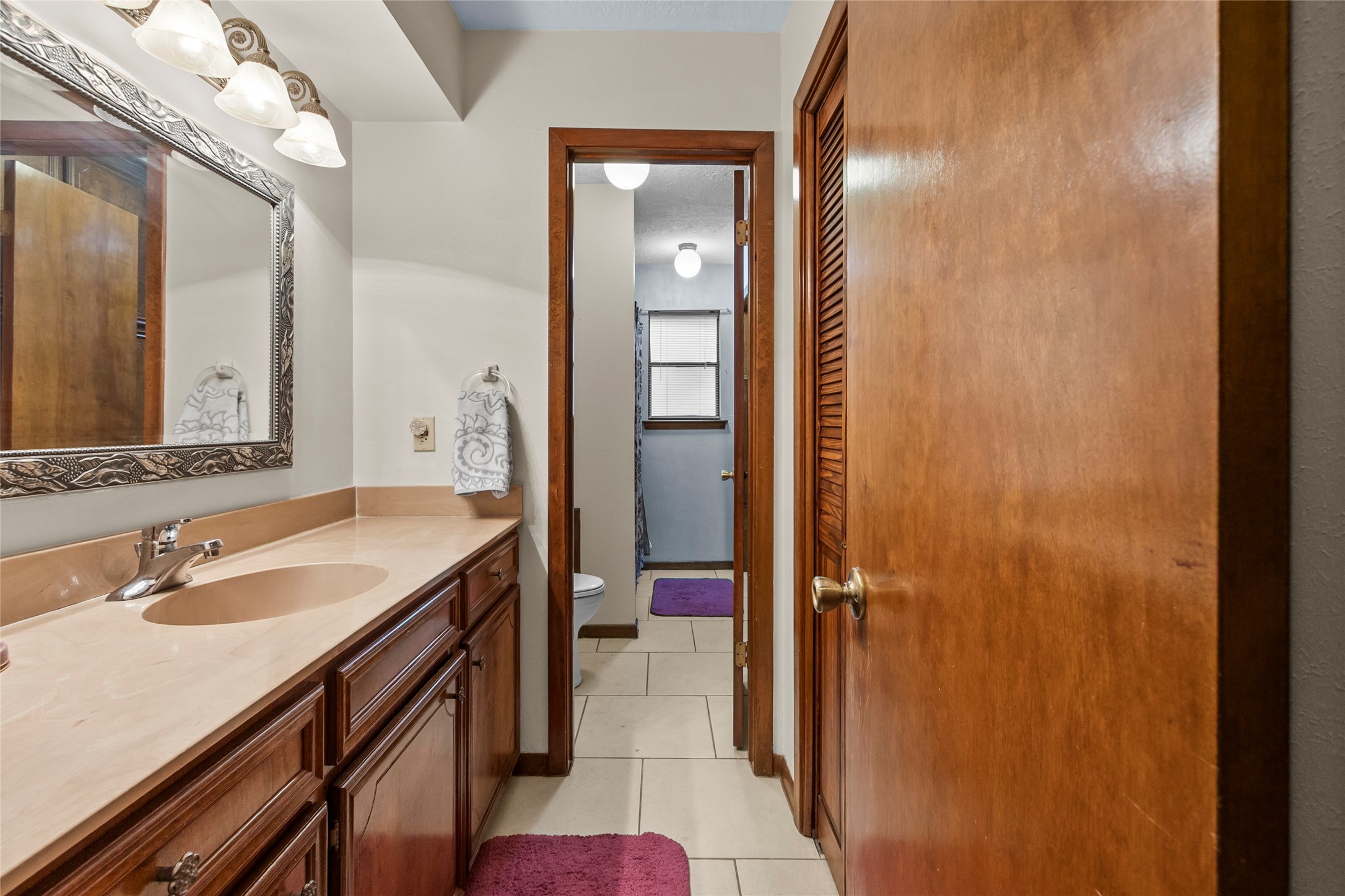 Bathroom in hall across from bedroom 1