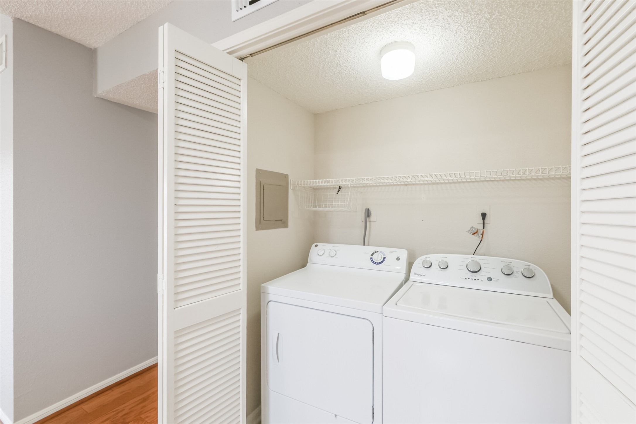Convenient utility room featuring an included washer and dryer!