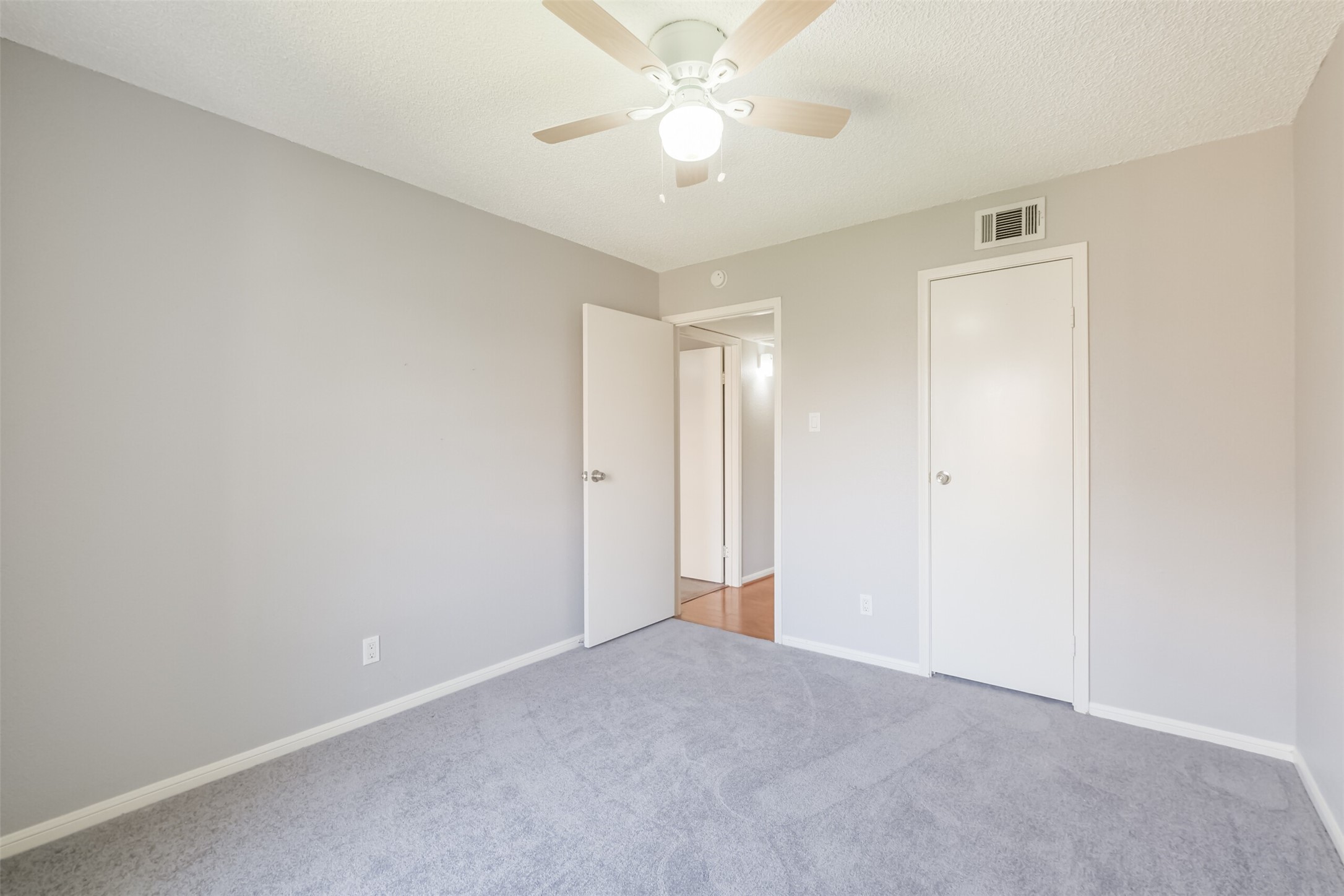 econdary bedroom featuring carpet and a ceiling fanperfect for a guest room, home office, or exercise space!