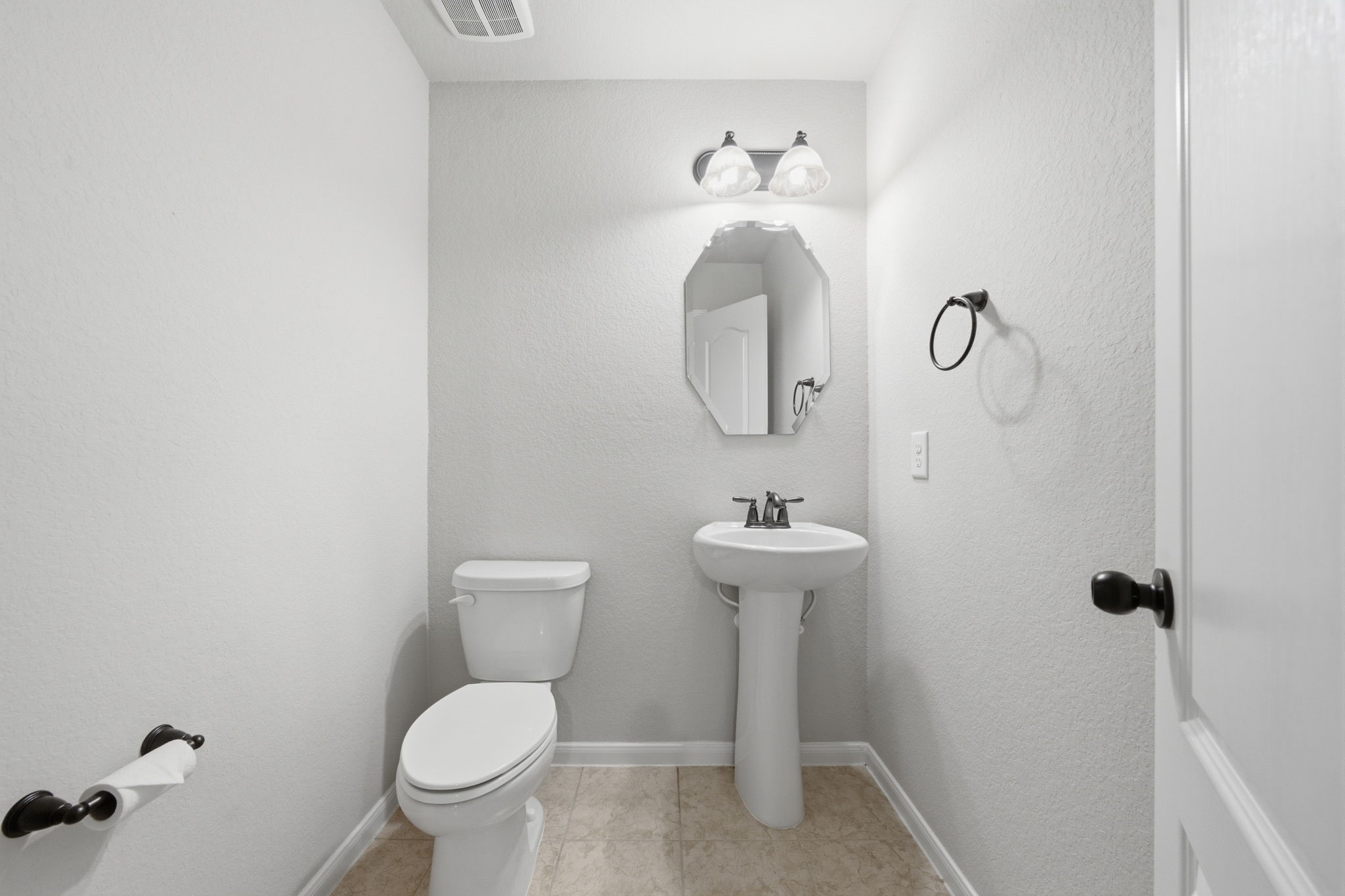 HALF BATH UPSTAIRS NEXT TO THE GAMEROOM