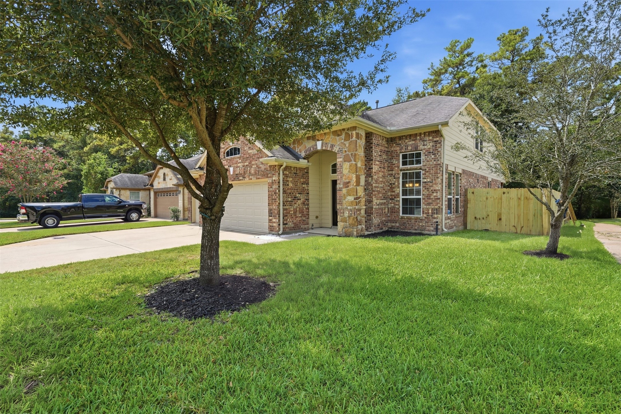 Classic brick and stone with an arched entry, a manicured lawn and mature shade trees. The side yard leads back to a fully fenced backyard. Classic brick and stone with an arched entry, a manicured lawn and mature shade trees. The side yard leads back to a fully fenced backyard.