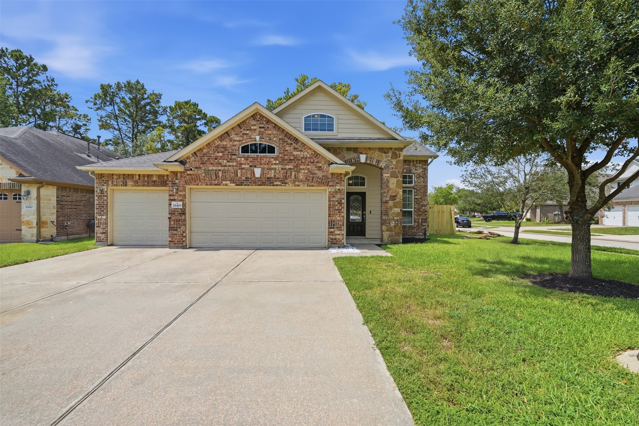 Curb appeal that stops traffic. Brick-and-stone elevation, arched stone entry, a rare 3-car garage and an extra-wide driveway, all on a quiet cul-de-sac street under mature shade. Curb appeal that stops traffic. Brick-and-stone elevation, arched stone entry, a rare 3-car garage and an extra-wide driveway, all on a quiet cul-de-sac street under mature shade.