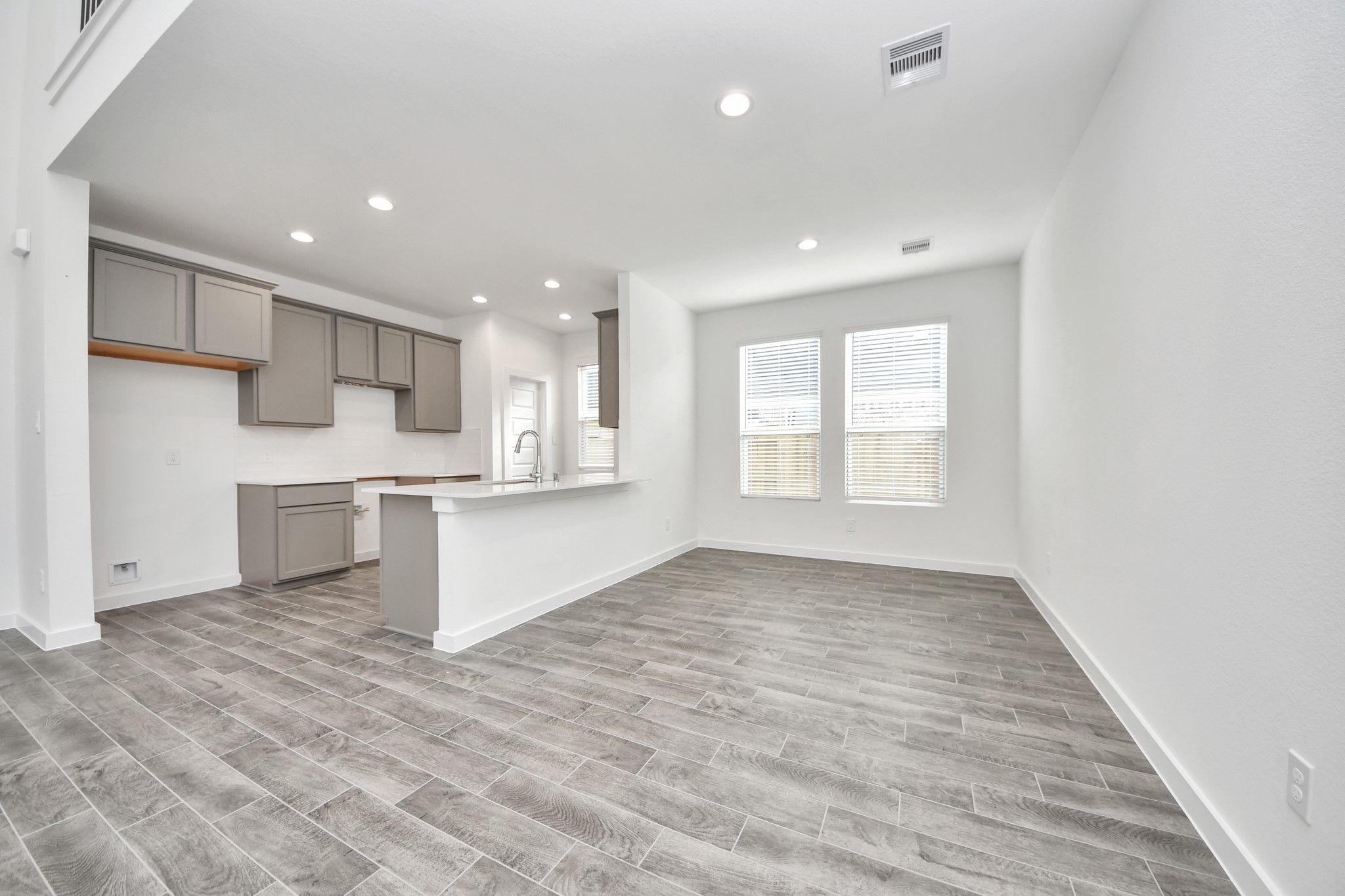 The extended counter area adds both practicality and style, making meal preparation a breeze. Every detail is thoughtfully designed to enhance the kitchen's functionality and aesthetic appeal. Sample photo of completed home with similar floor plan. Actual colors and selections may vary.