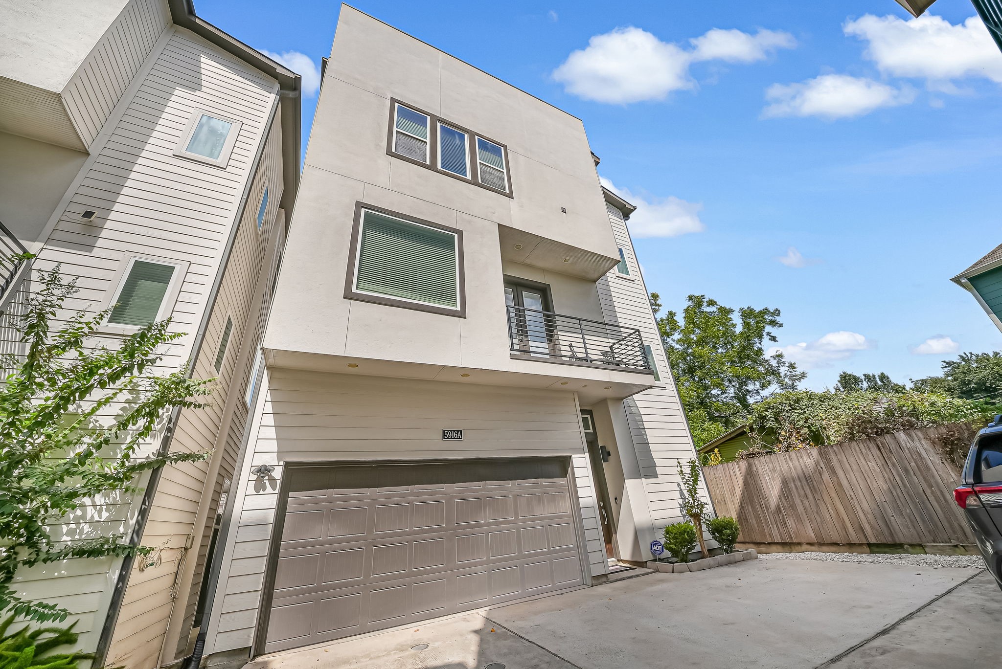 Private two-car garage with additional parking and direct access to the home's balcony and outdoor living spaces.