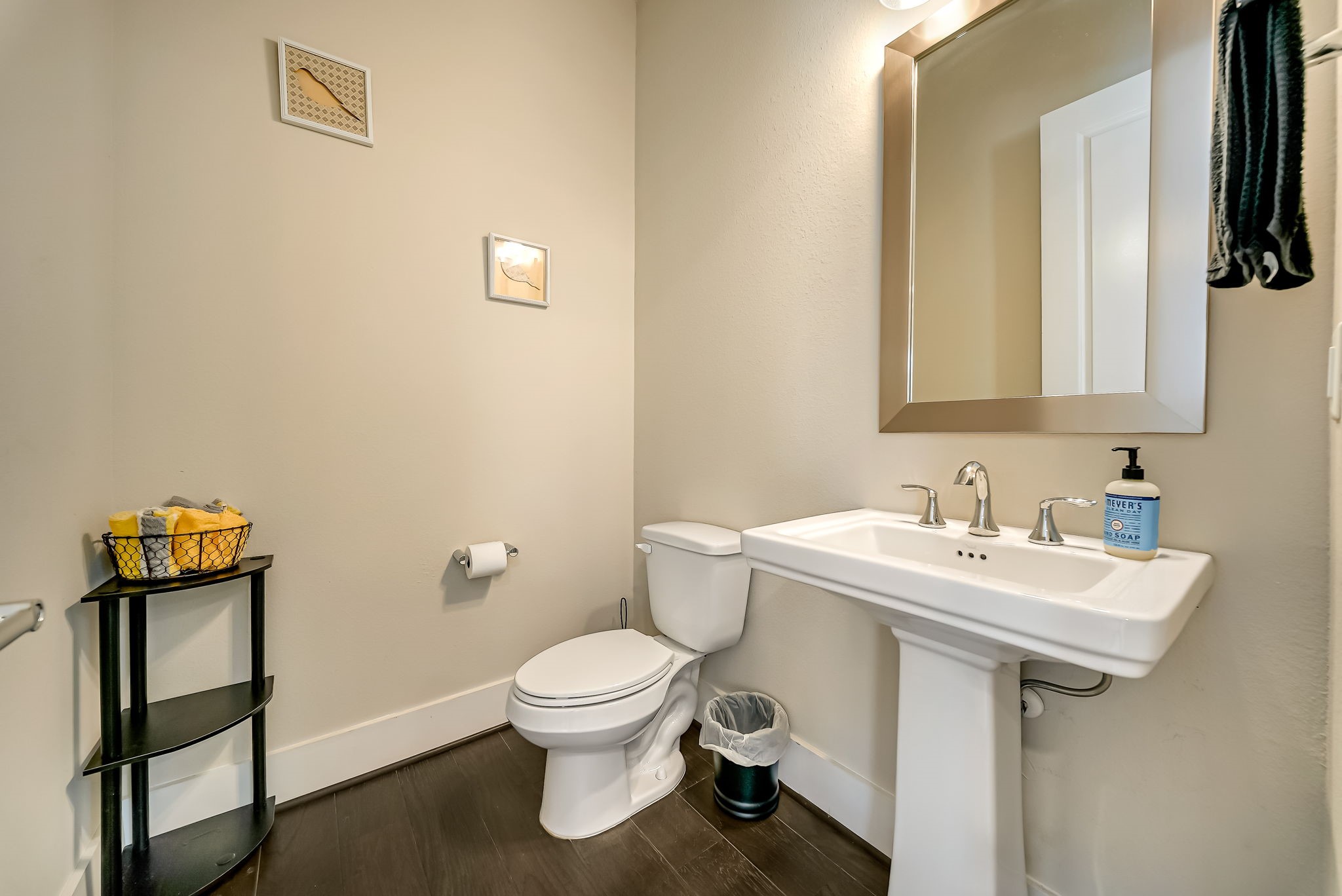 Convenient powder room located on the main living level for guests.