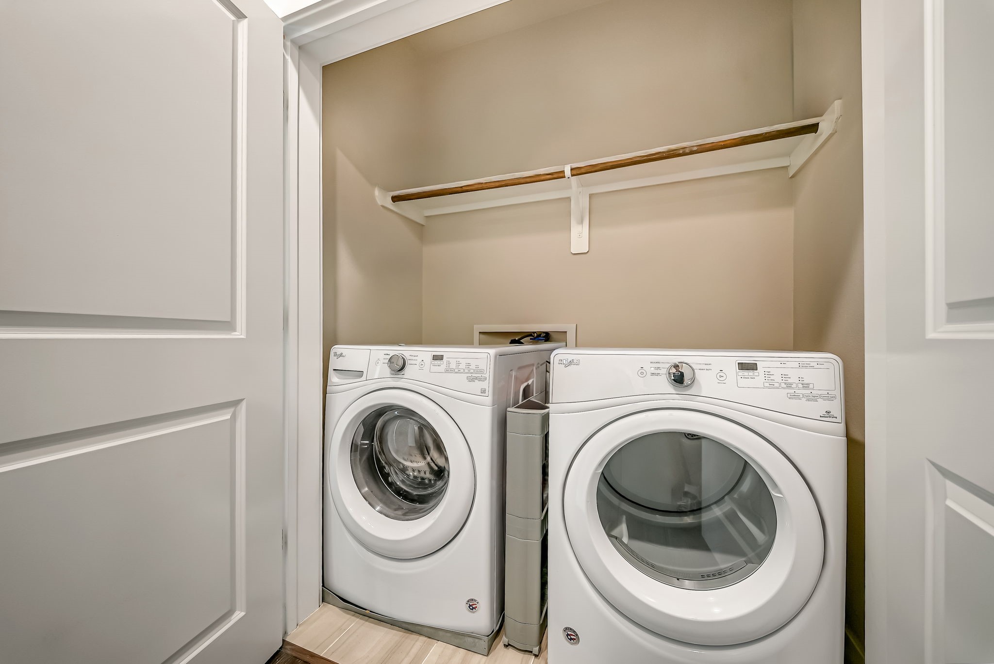 Dedicated laundry area with discreet enclosure and added functionality. Washer and Dryer convey