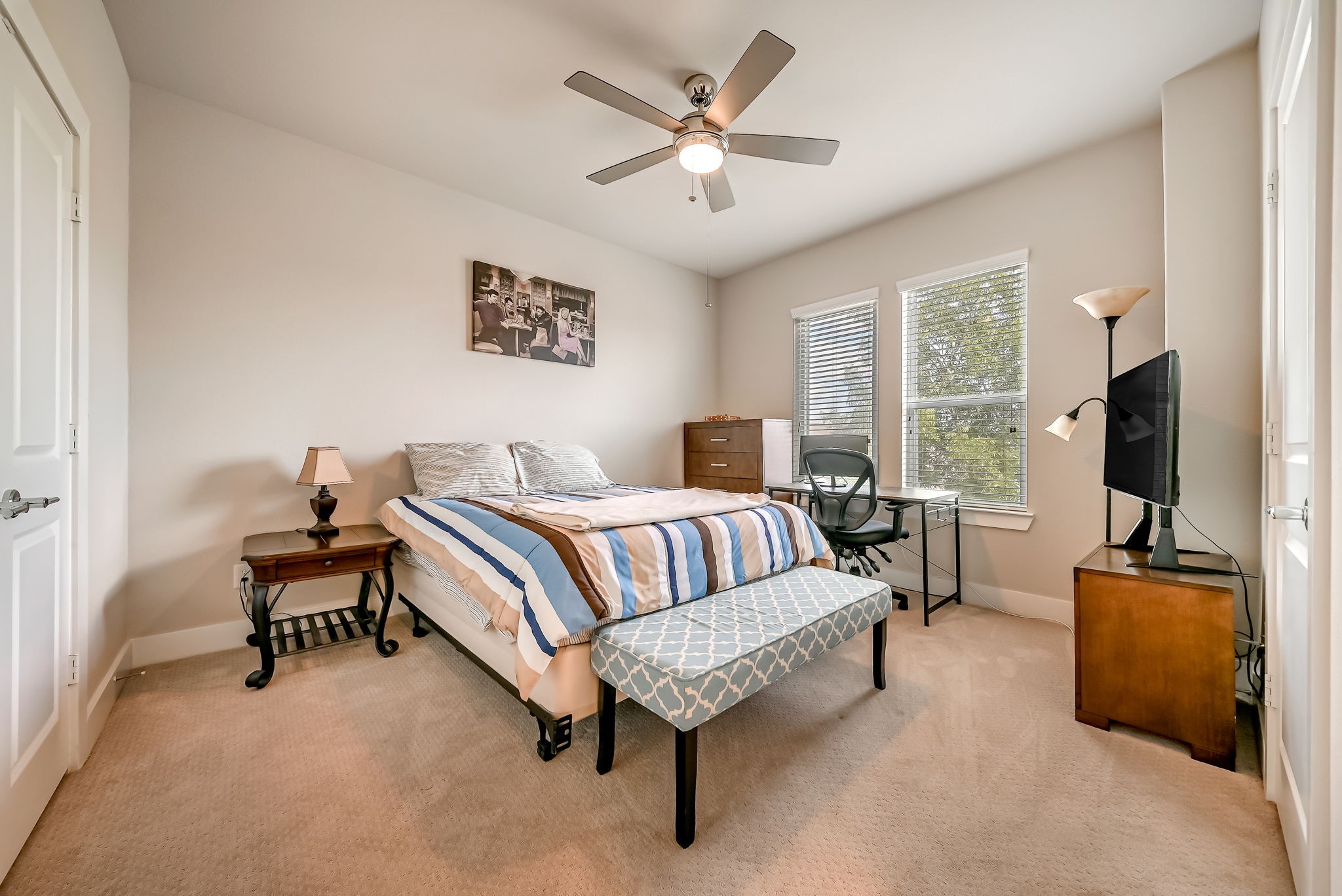 Alternate view of the spacious secondary bedroom with room for a variety of furniture layouts.