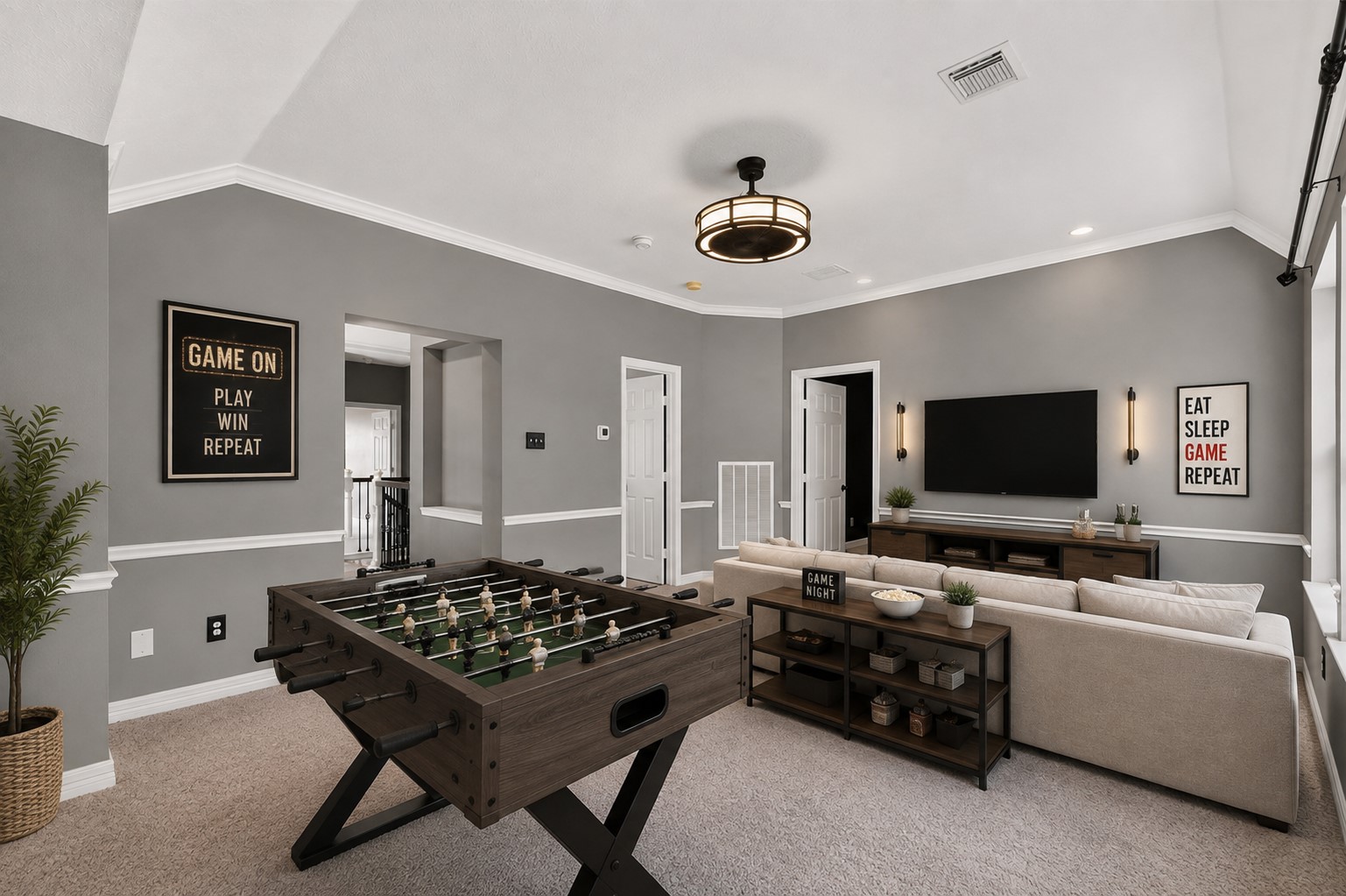 Game room virtually staged to illustrate the generous space for games, movies and a secondary living area.