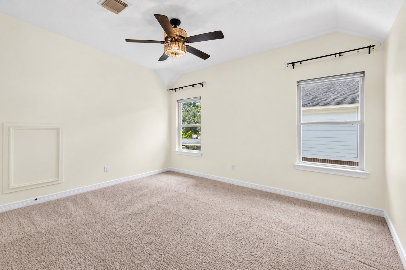 Upstairs bedroom with vaulted ceiling, natural light and the added privacy of its own ENSUITE BATH.