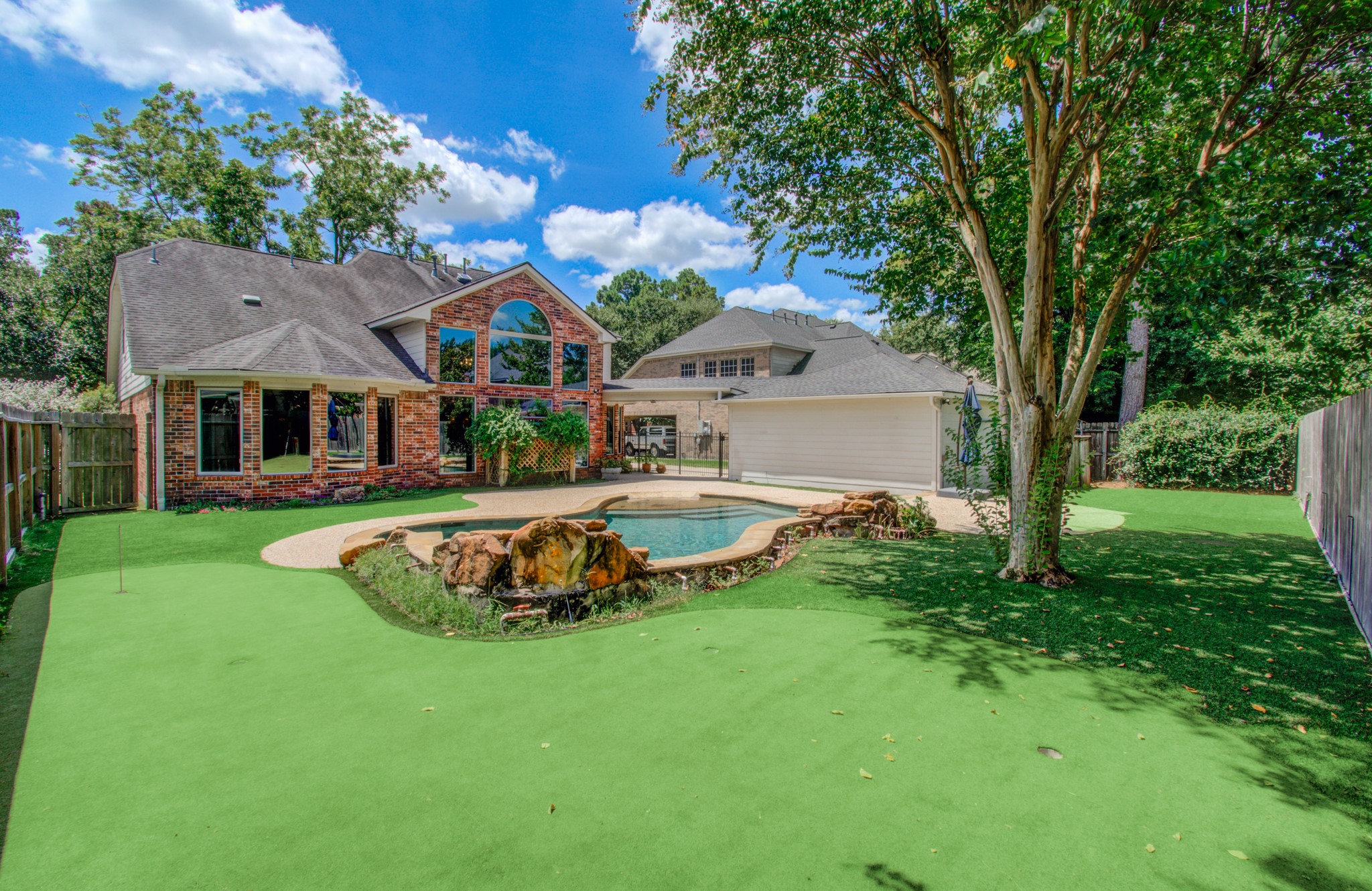 Low-maintenance turf surrounds the pool and provides additional backyard space for play, pets and outdoor entertaining.
