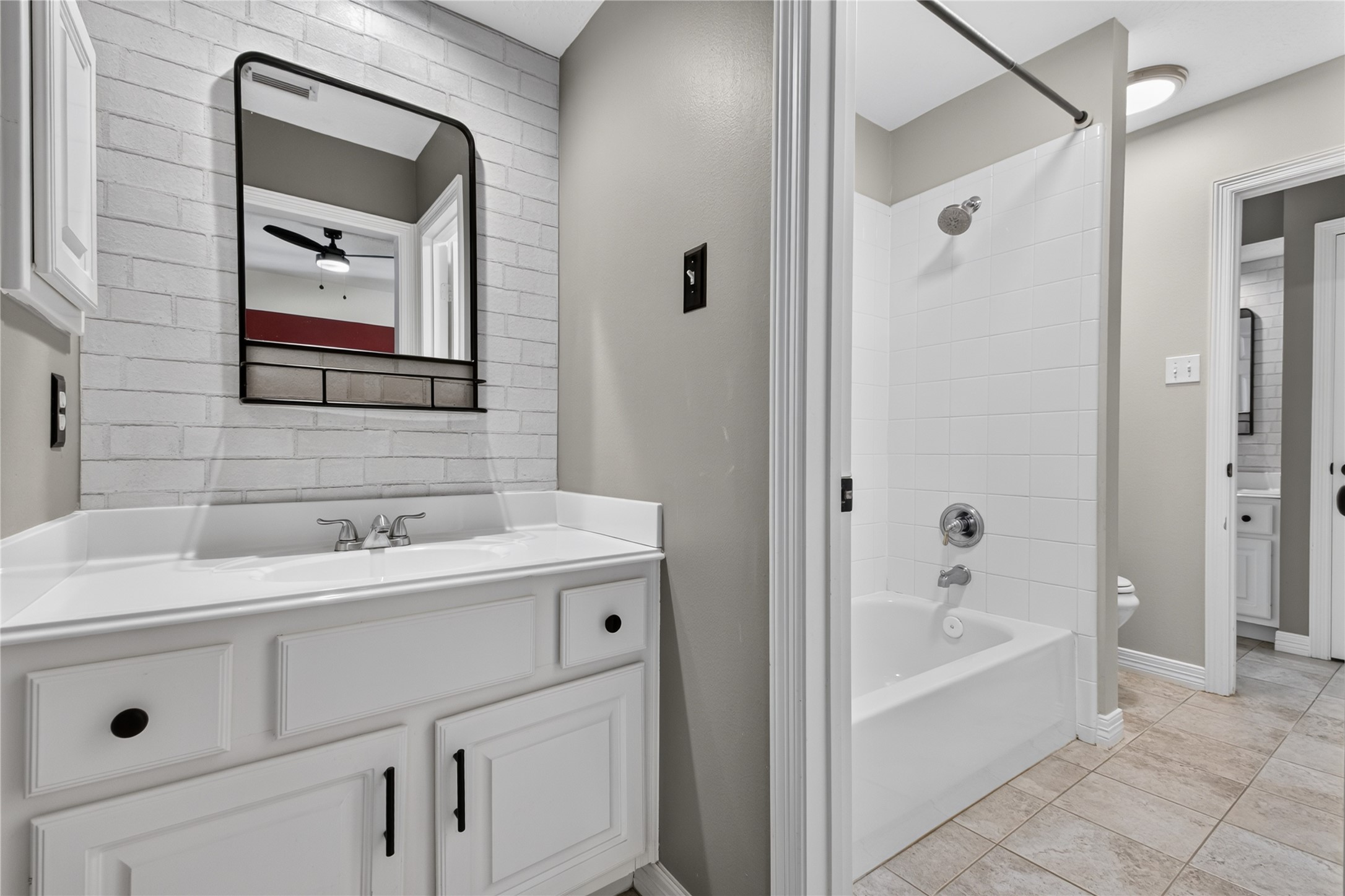 Jack & Jill bath connects two upstairs bedrooms and features separate vanity areas for added privacy and convenience.
