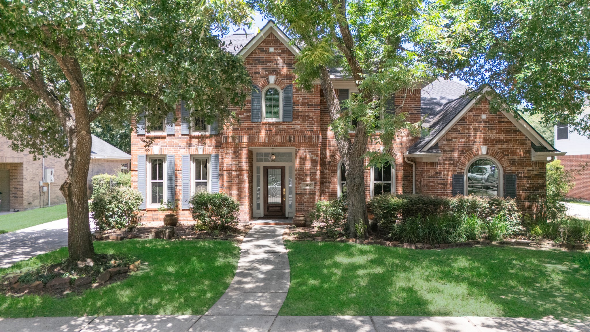 Classic brick architecture, mature landscaping and an inviting front entry give this home timeless curb appeal.