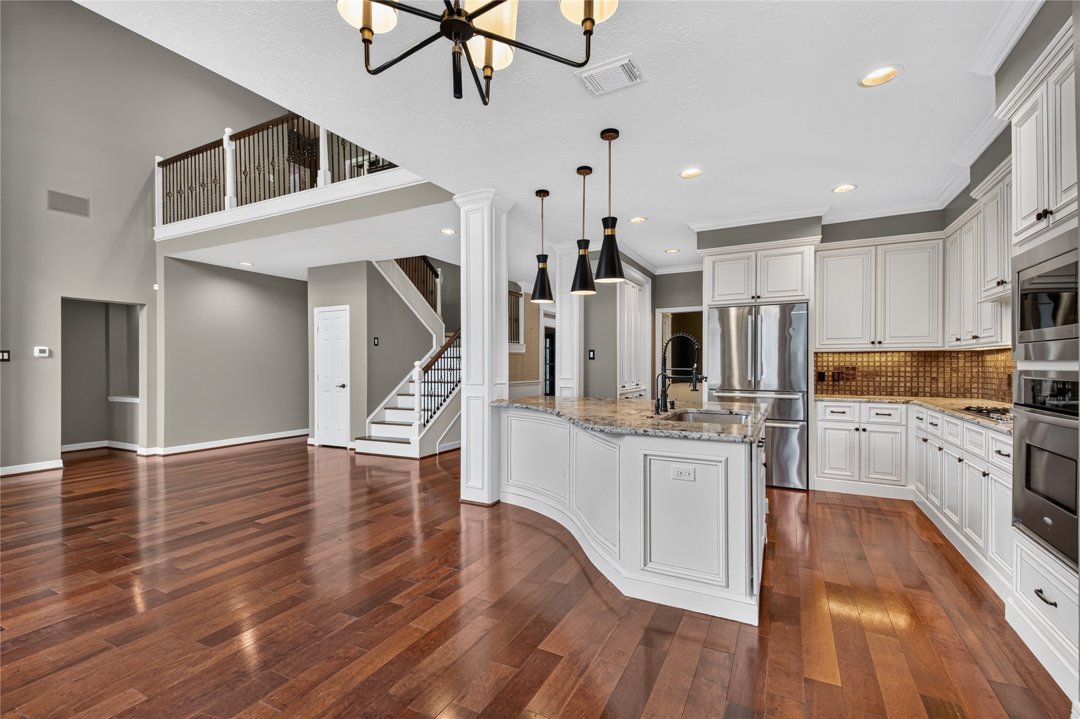 Open-concept kitchen, breakfast area and family room create an easy flow for everyday living and entertaining.