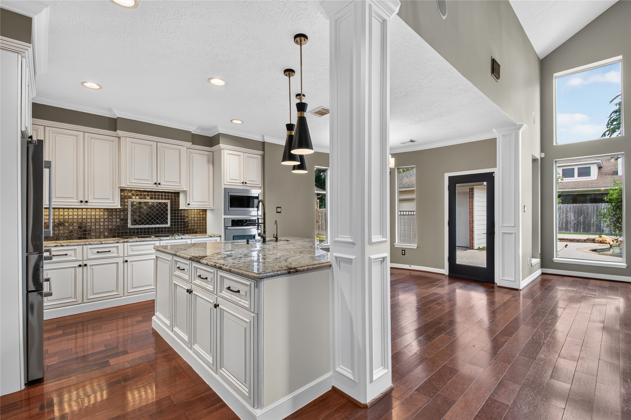 Spacious island kitchen opens directly to the family room with abundant prep, storage and gathering space.