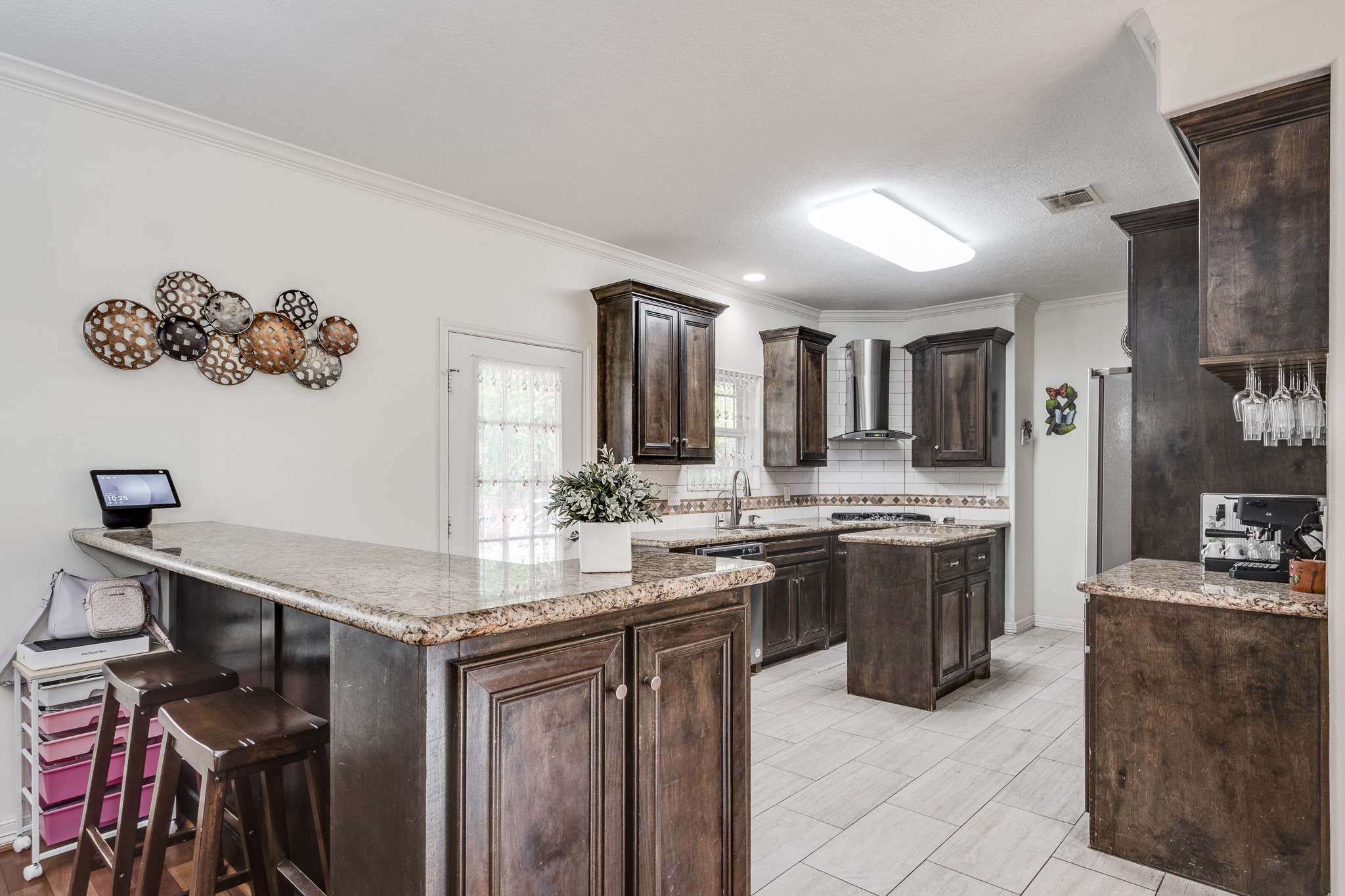 Custom kitchen with granite countertops and real wood cabinets.