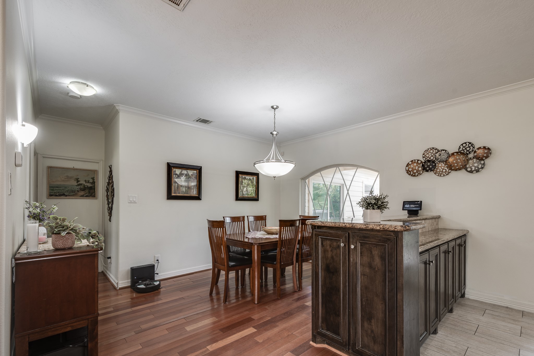 Dining area with table for 6 but could be for 10. With breakfast bar.