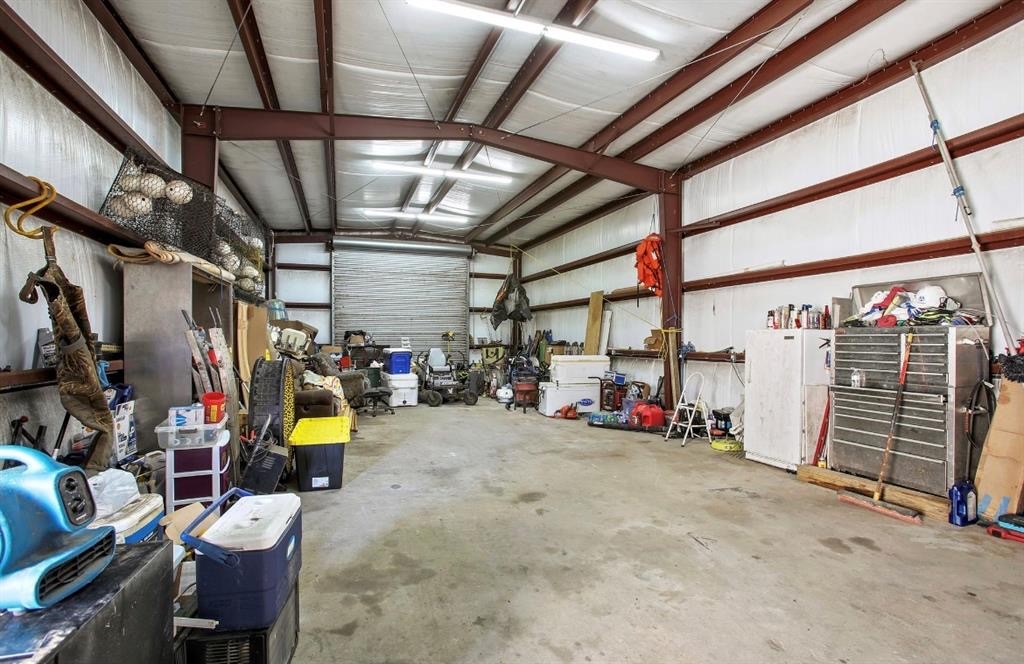 Interior photo of shop shows expansive workspace, lighting and insulation.