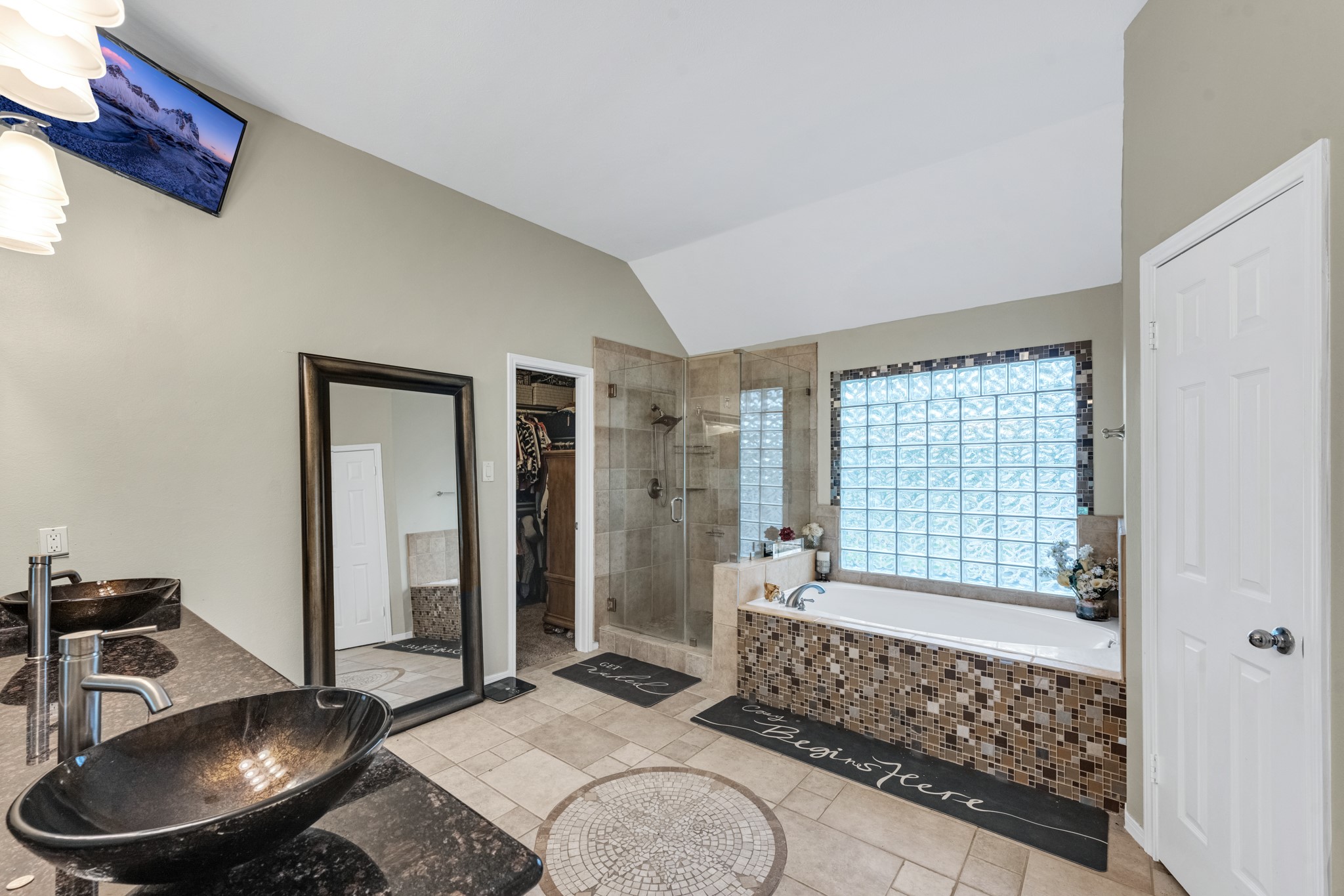 The primary bathroom offers dual sinks, soaking tub, separate shower and a large walk in closet.