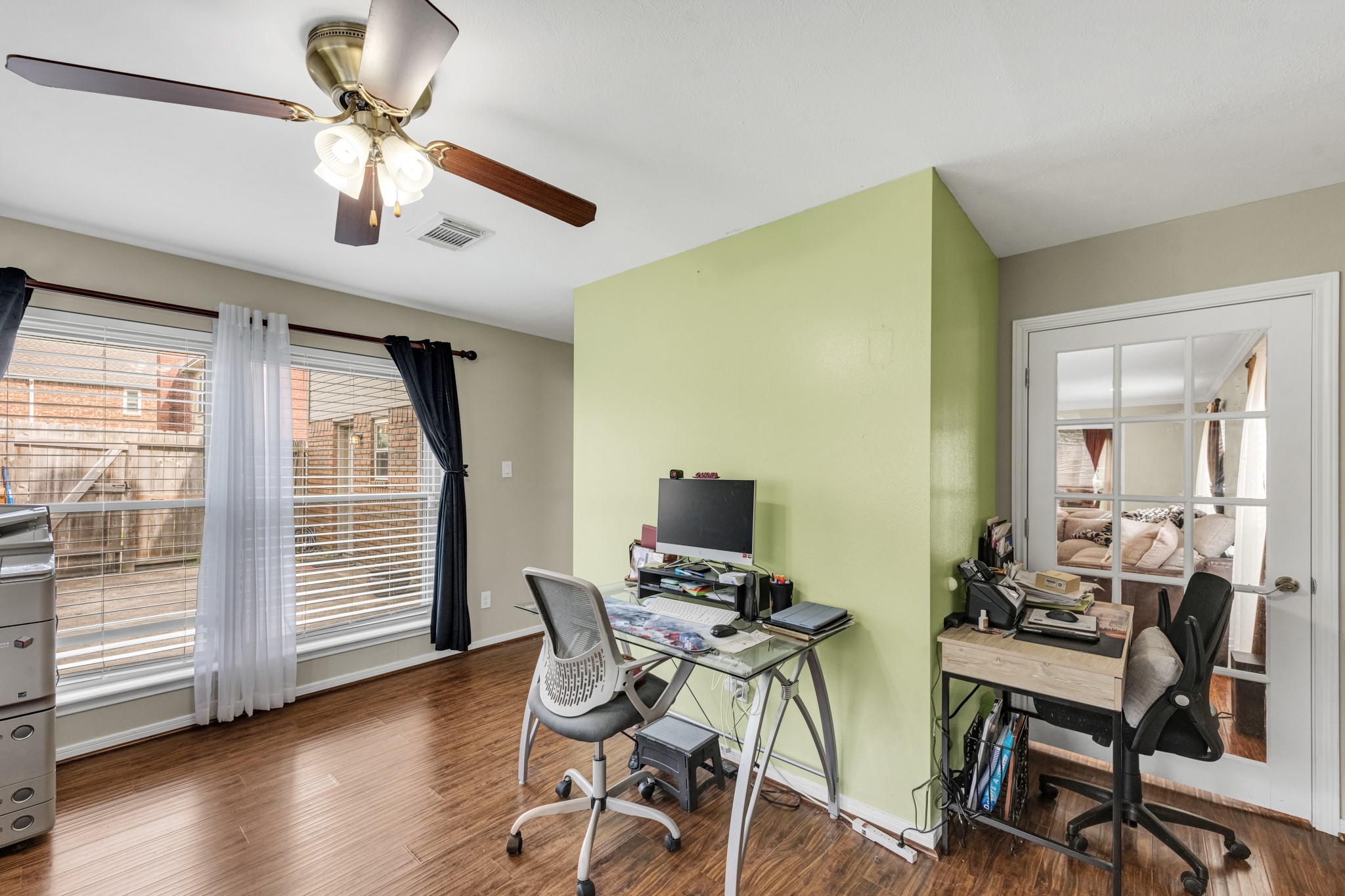 The home office has two doors to the family room