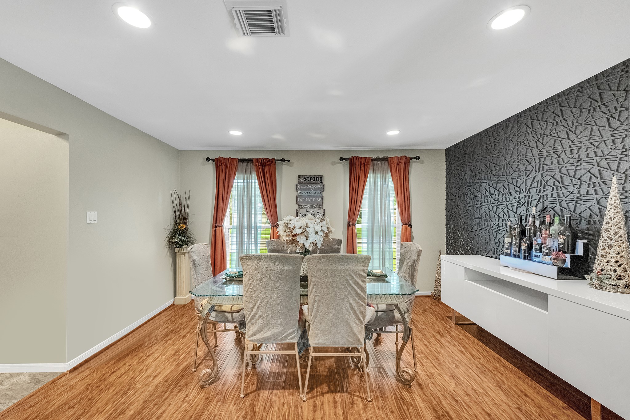The formal dining room with beautiful accent wall.