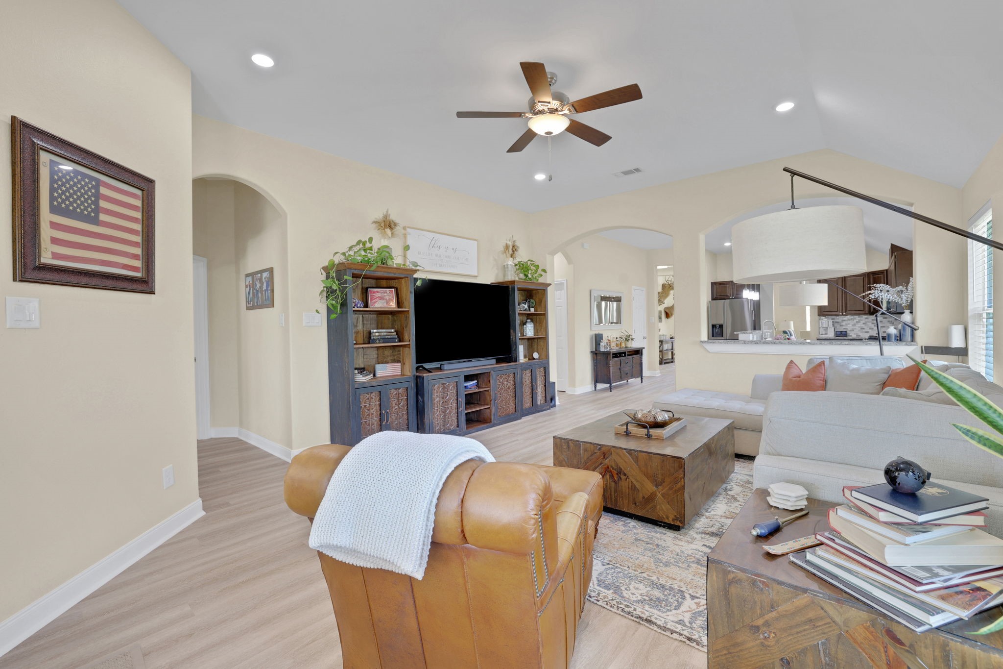 Family room with newly installed Luxury Vinyl Flooring that flows seamlessly from the front door all the way through the main living areas