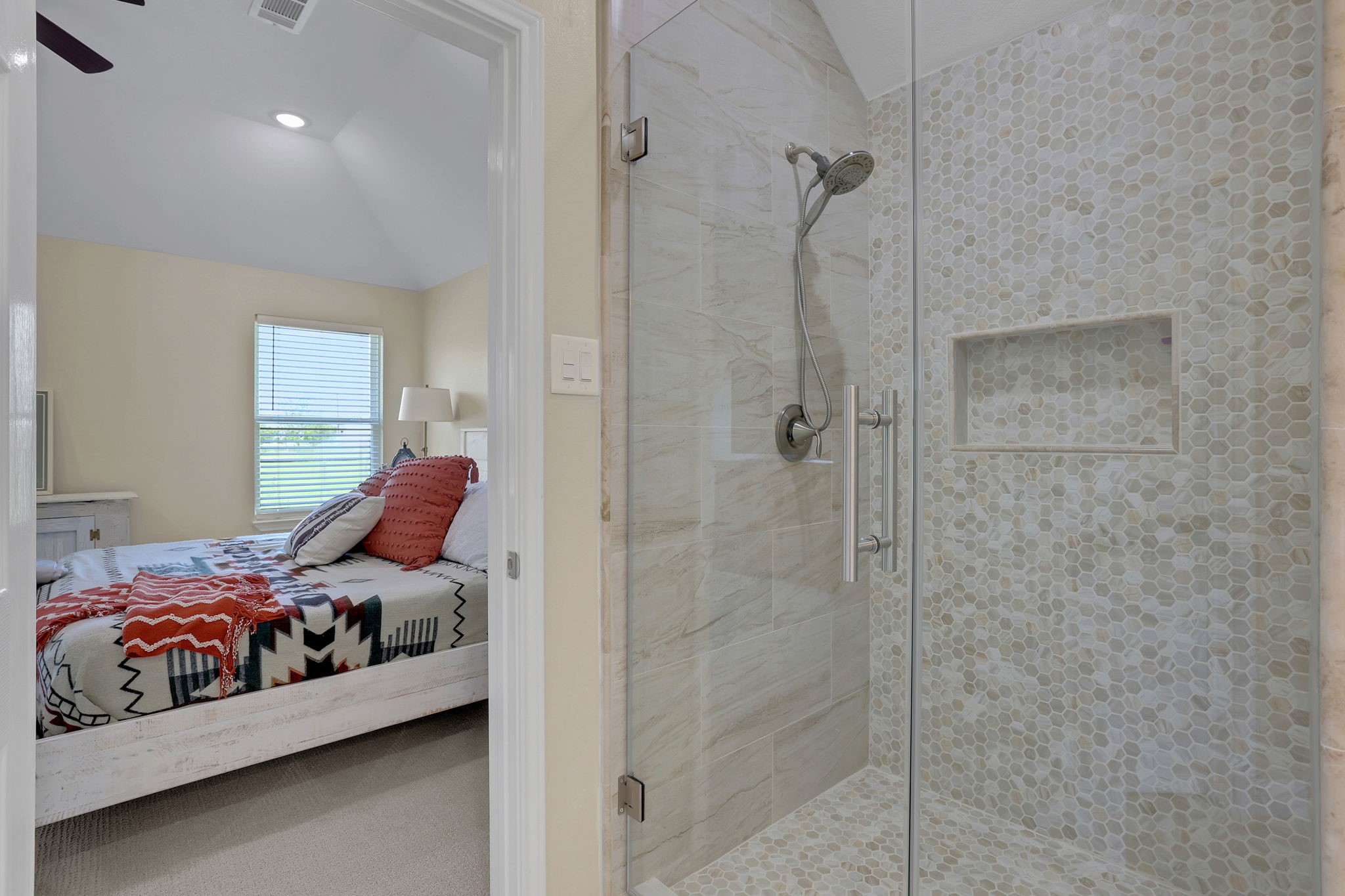Luxuriously updated primary shower with freshly updated tile