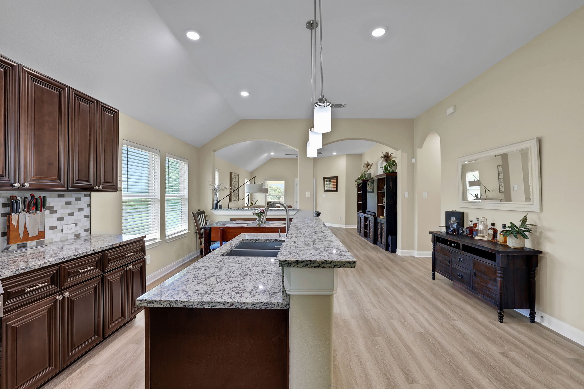 The kitchen is pristine with granite countertops and stainless appliances