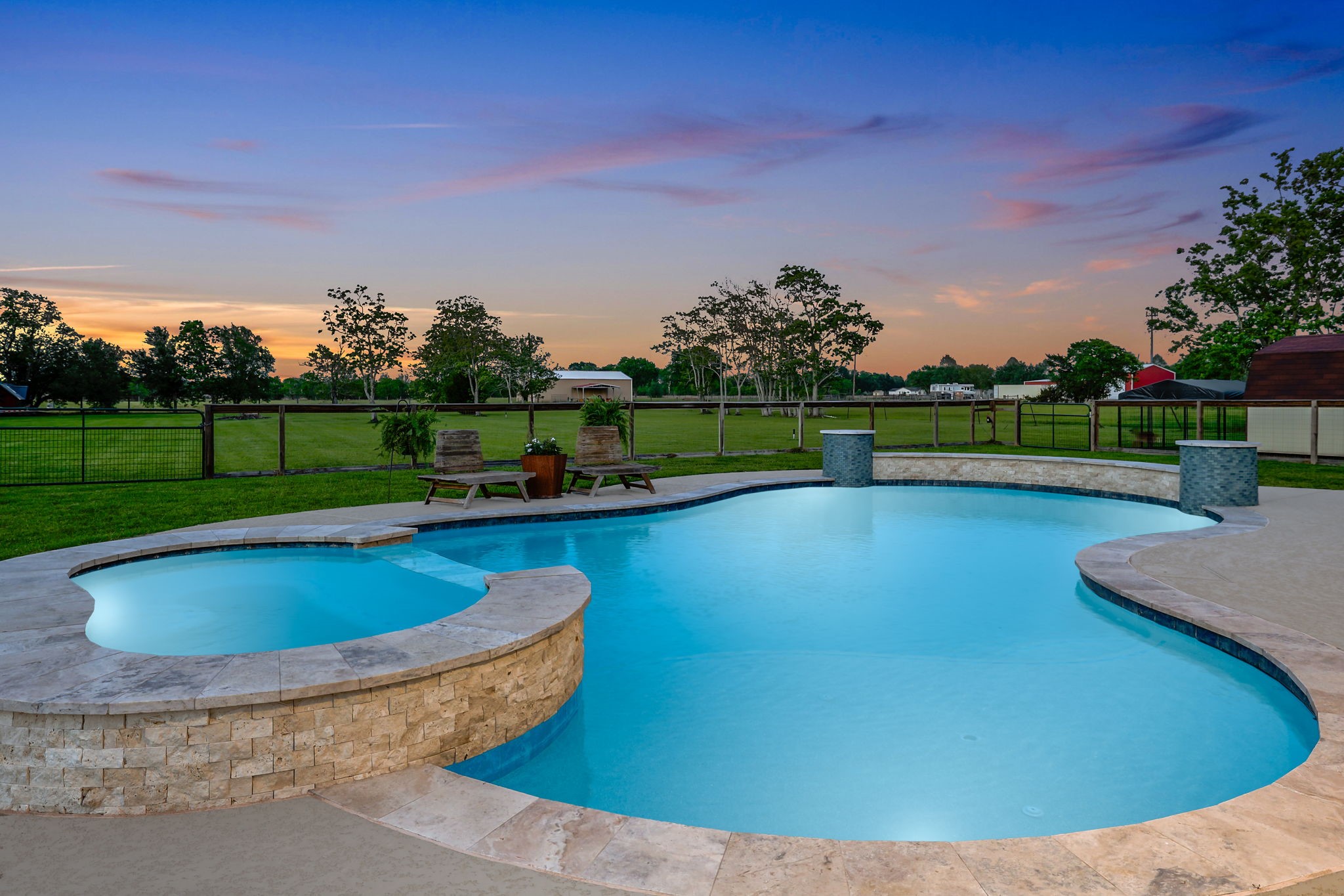 Dive into luxury with a stunning poolside view of the breathtaking Texas sunset, promising unforgettable evenings.