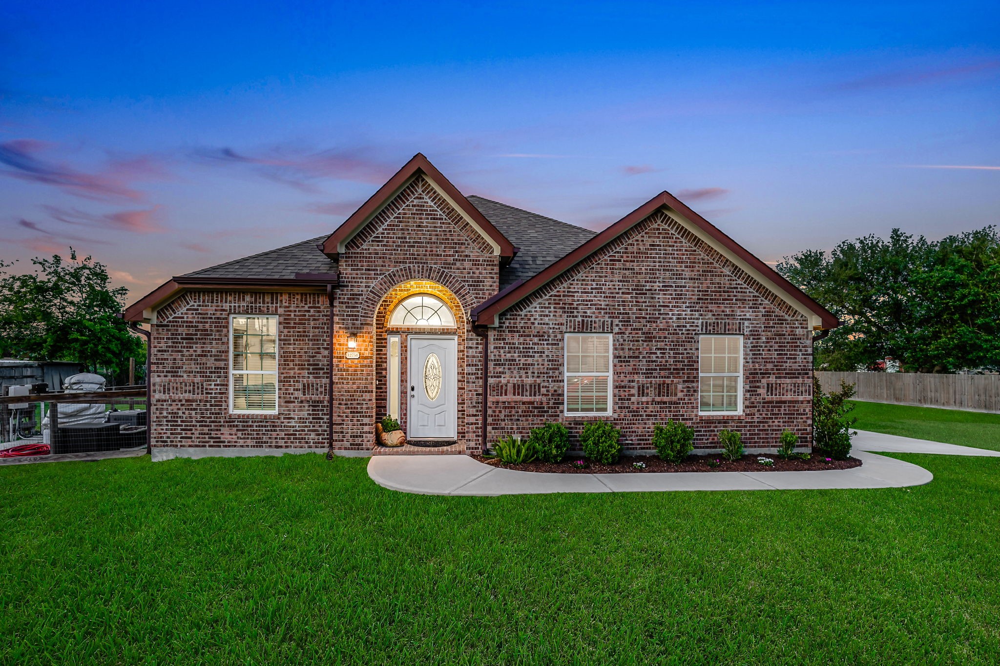 Discover the charm of your new home with its stunning brick details and inviting entryway.