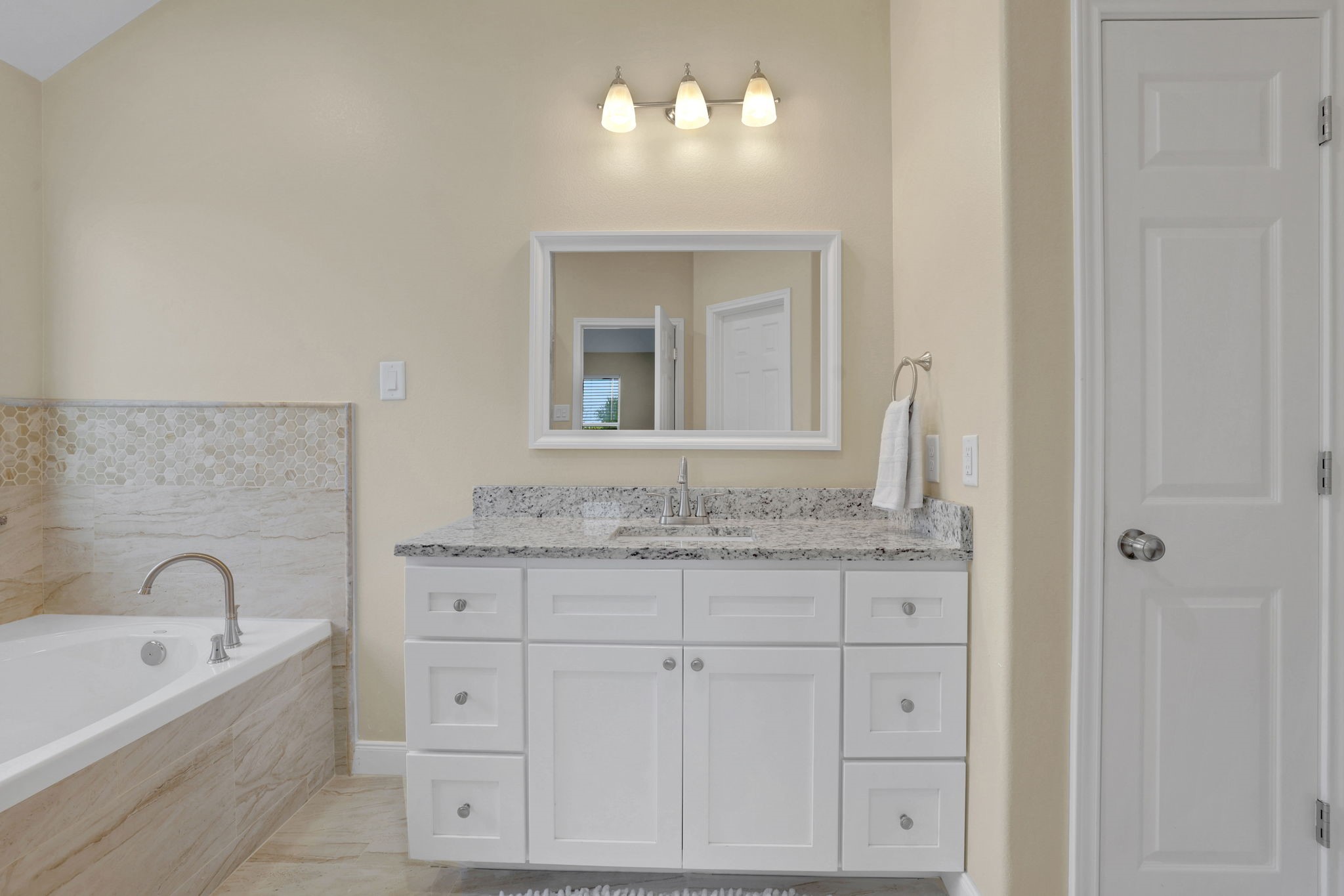 Primary bathroom w/granite countertops